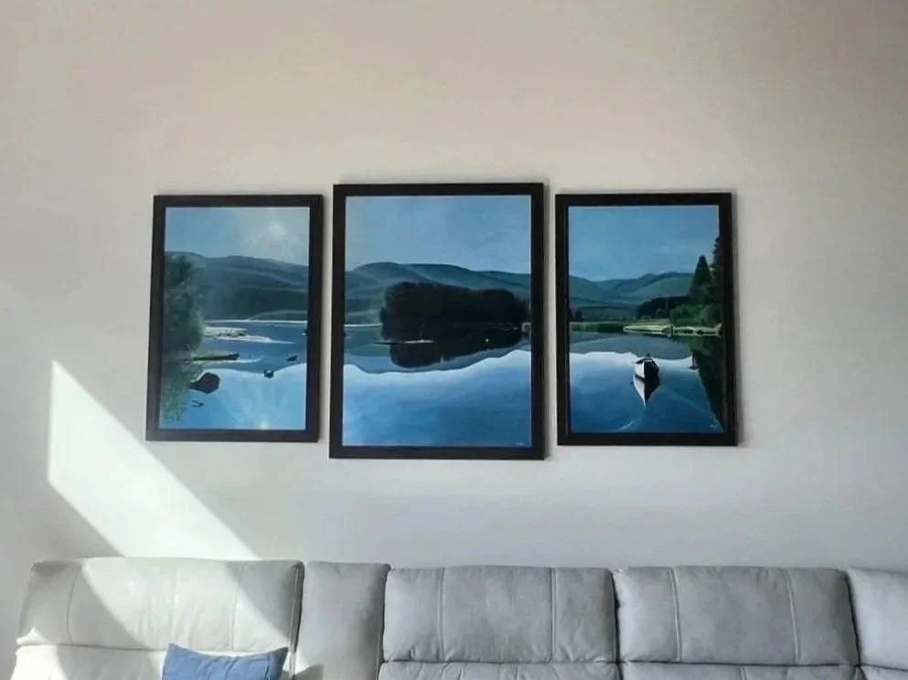 series of three paintings with a lake and mountains in the background