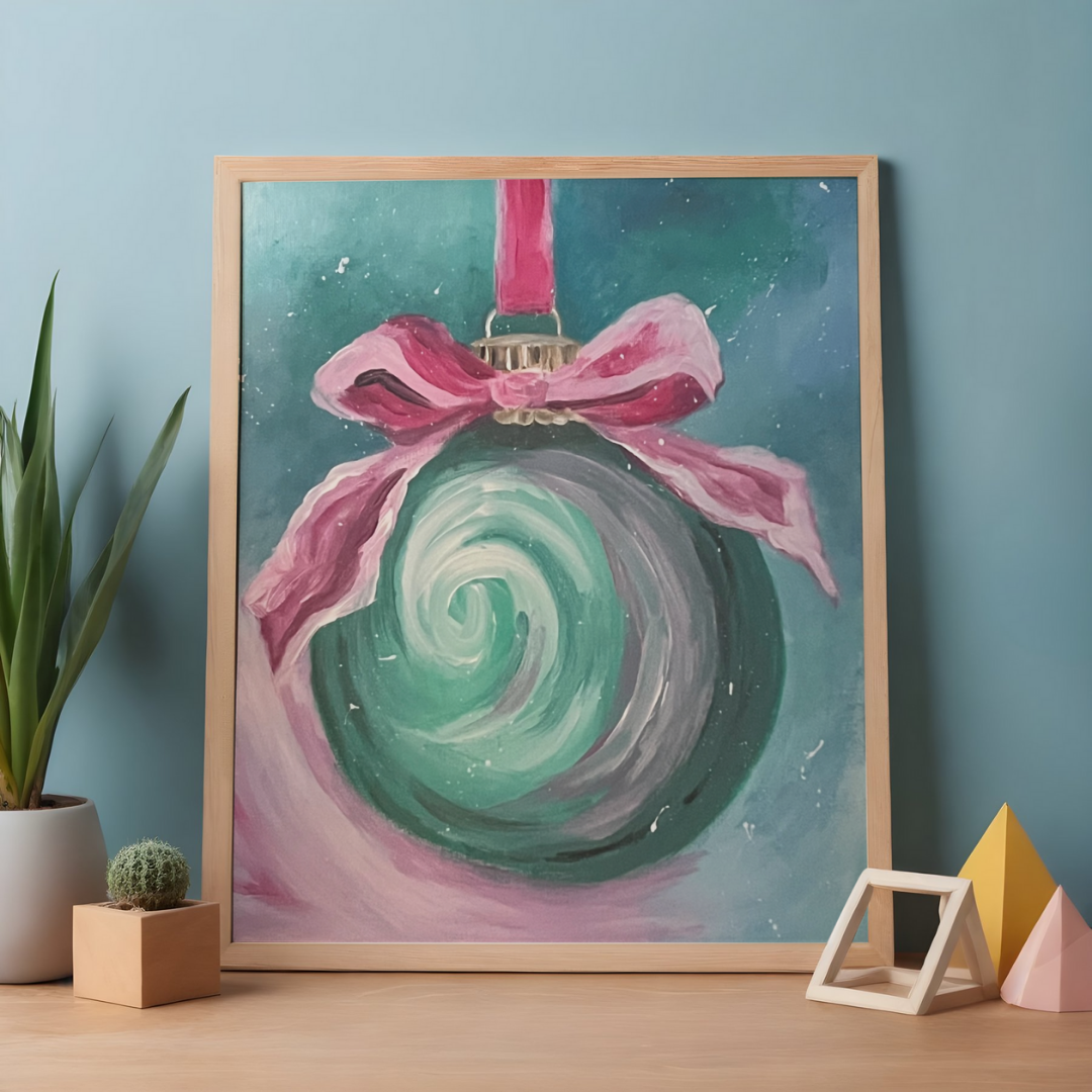 teal christmas bulb with a pink ribbon