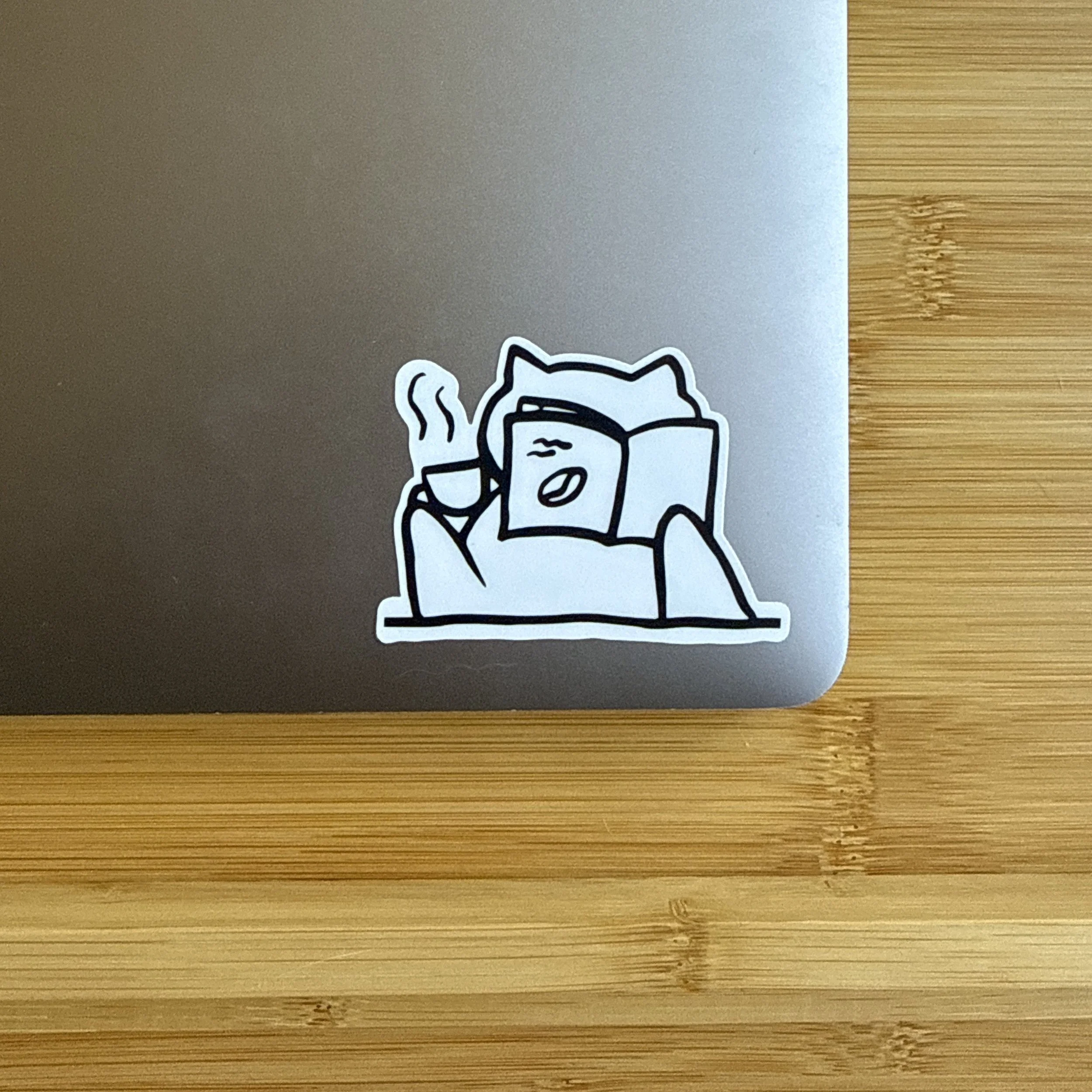 reading book laptop up close.jpeg