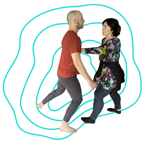 Two people dancing closely, holding each other with a serious facial expression.
