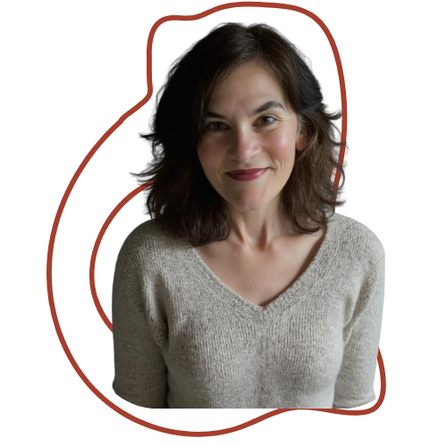 A woman with shoulder-length dark brown hair, wearing a light gray sweater, smiling at the camera.