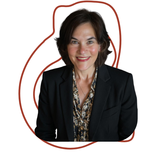 A professional woman with short dark hair and a bright smile, wearing a black blazer over a patterned blouse, against a red background.