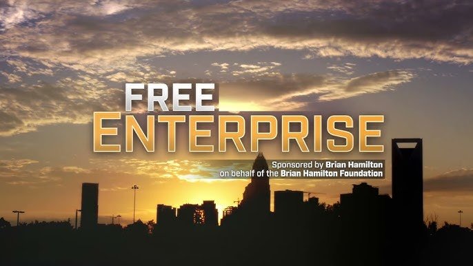 Silhouette of a city skyline at sunset with "FREE ENTERPRISE" text overlay, sponsored by Brian Hamilton Foundation.