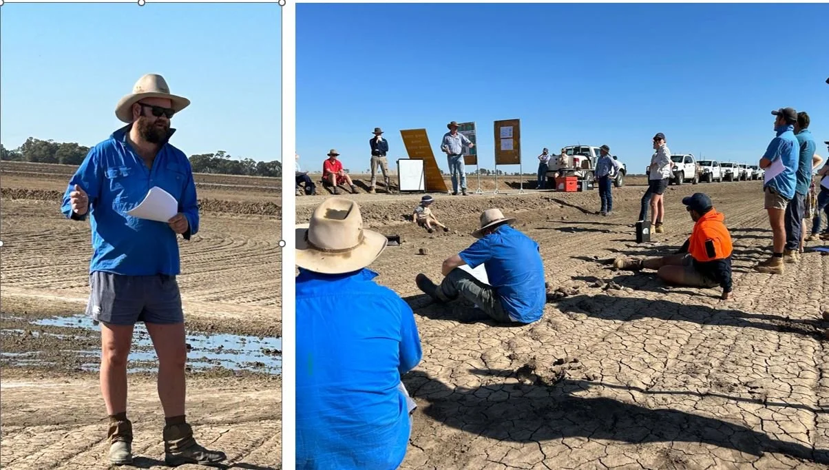 People gathered outdoors on a dry, cracked earth landscape with a clear blue sky, participating in a focus site group meeting