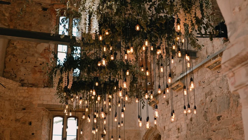 Hanging pendant lights in the ceremony space at Lulworth Castle in Dorset