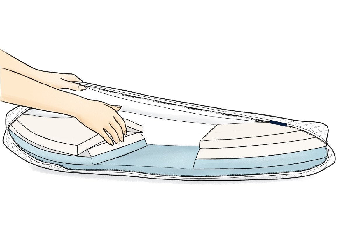 Person adding foam layers into a Mylevel Pillow to alter the side sleeping support and height