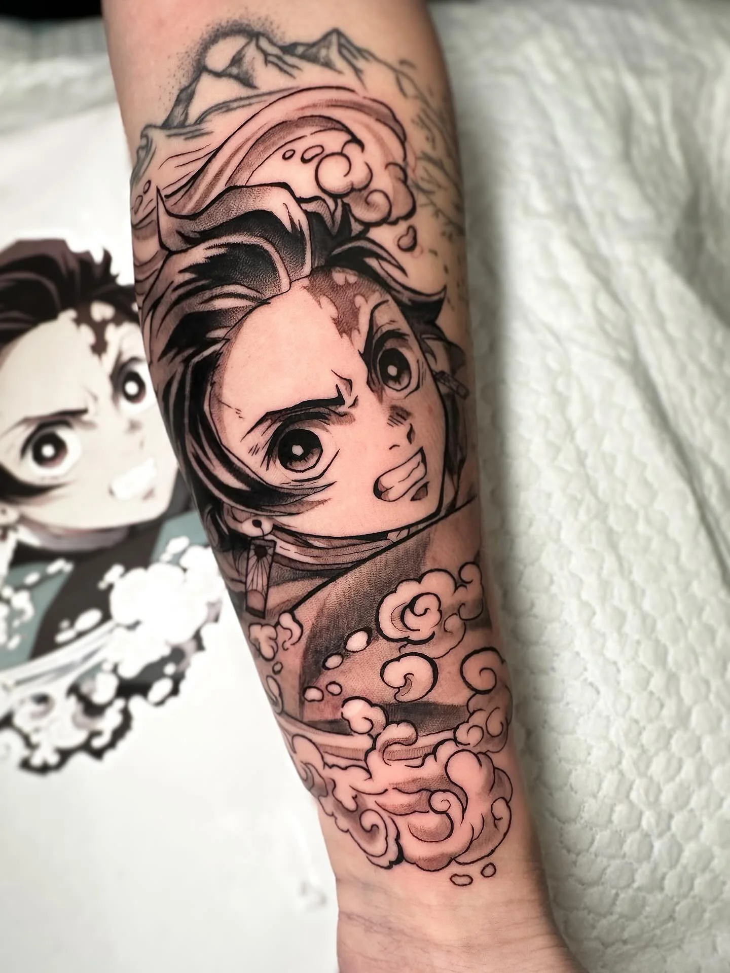 A black and grey tanjiro forearm filler tattoo- from a while back! 

#tanjiro #tanjirotattoo #animetattoo #mangatattoo #demonslayertattoo
