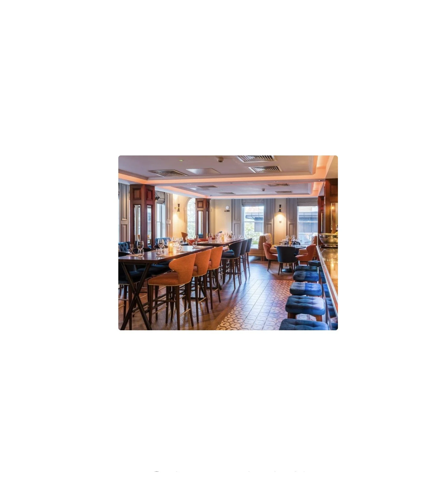 Asiko Architects Ltd — Elegant restaurant interior with high tables, colorful chairs, and large windows letting in natural light.