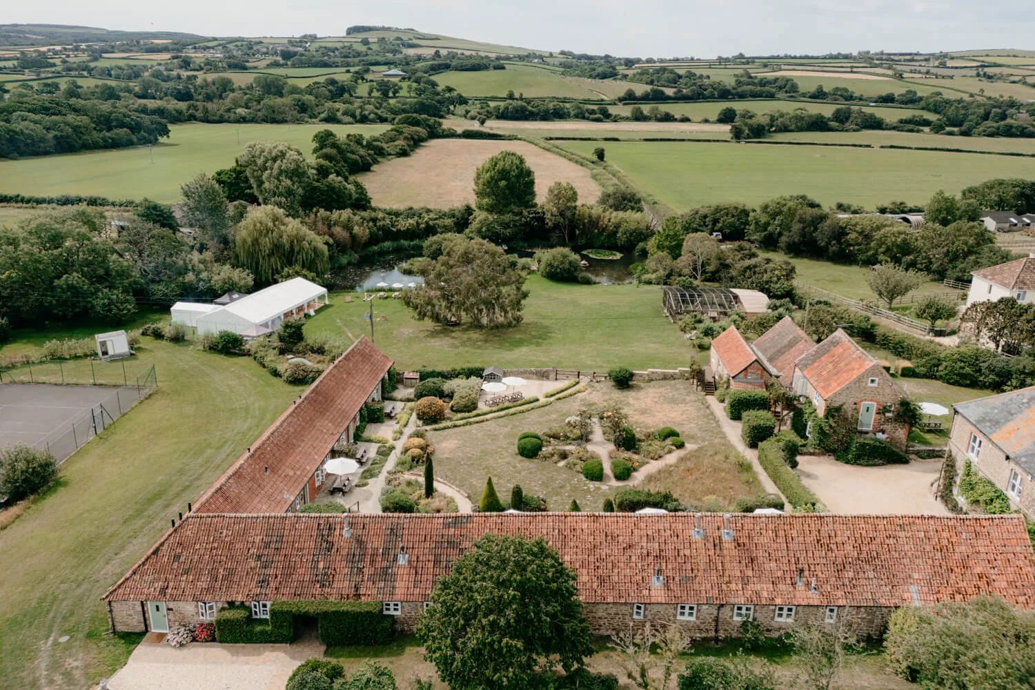 Drone photograph of the Dorset wedding venue Rudge Farm taken by Wedding Photographers pip&clo