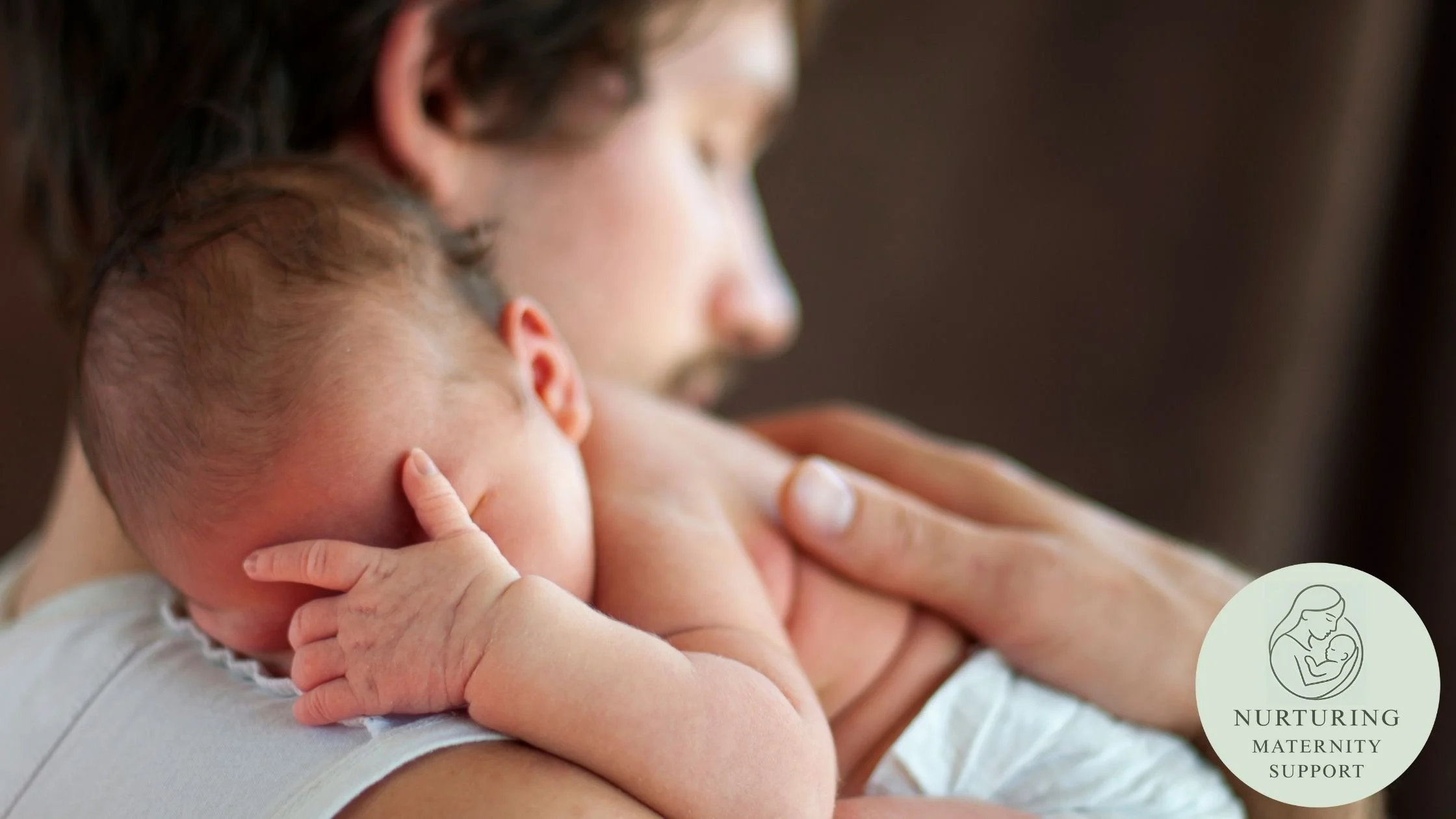 father learning how to care for newborn