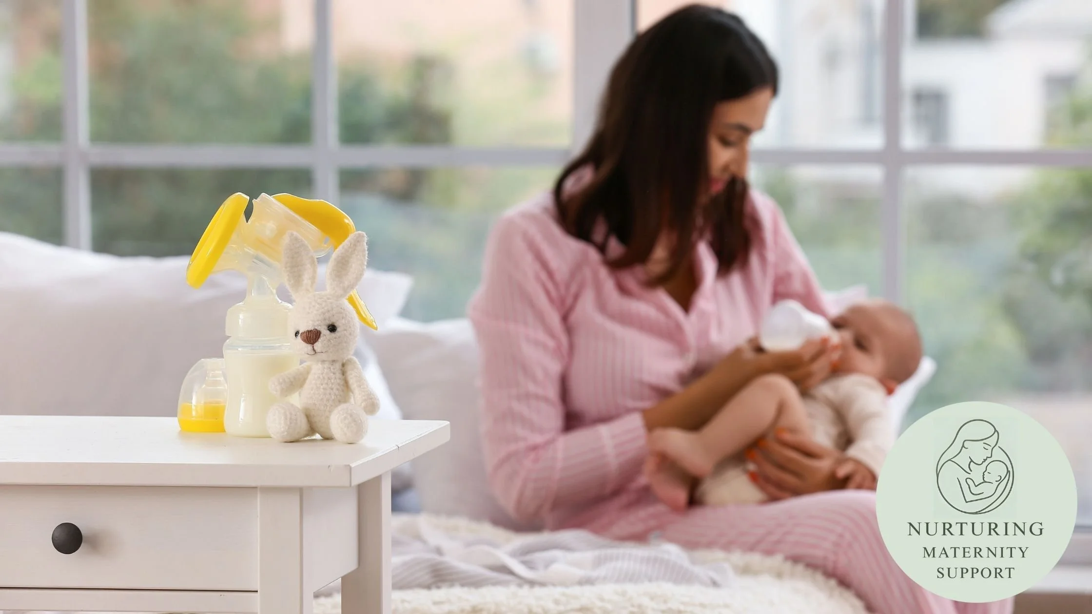 Baby being fed by bottle with breastmilk