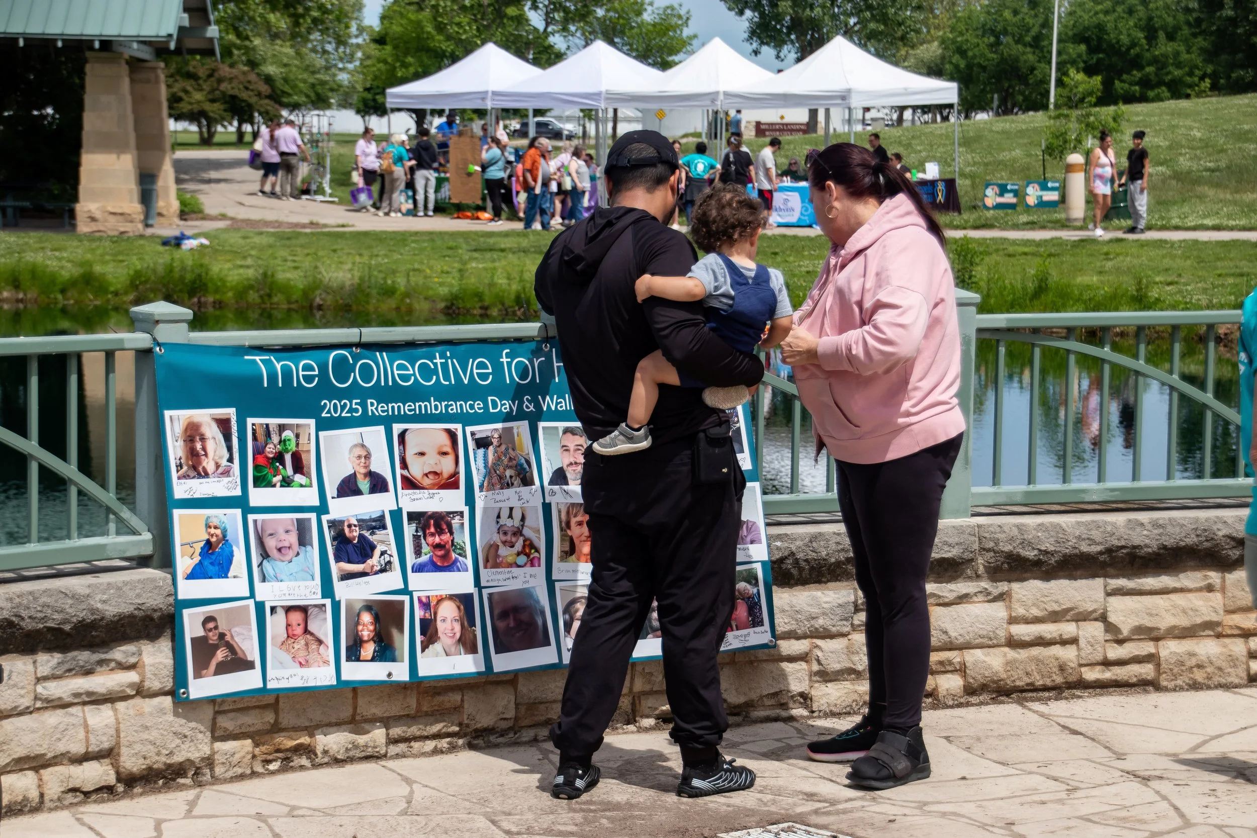 Family staring at banner at remembrance day community event
