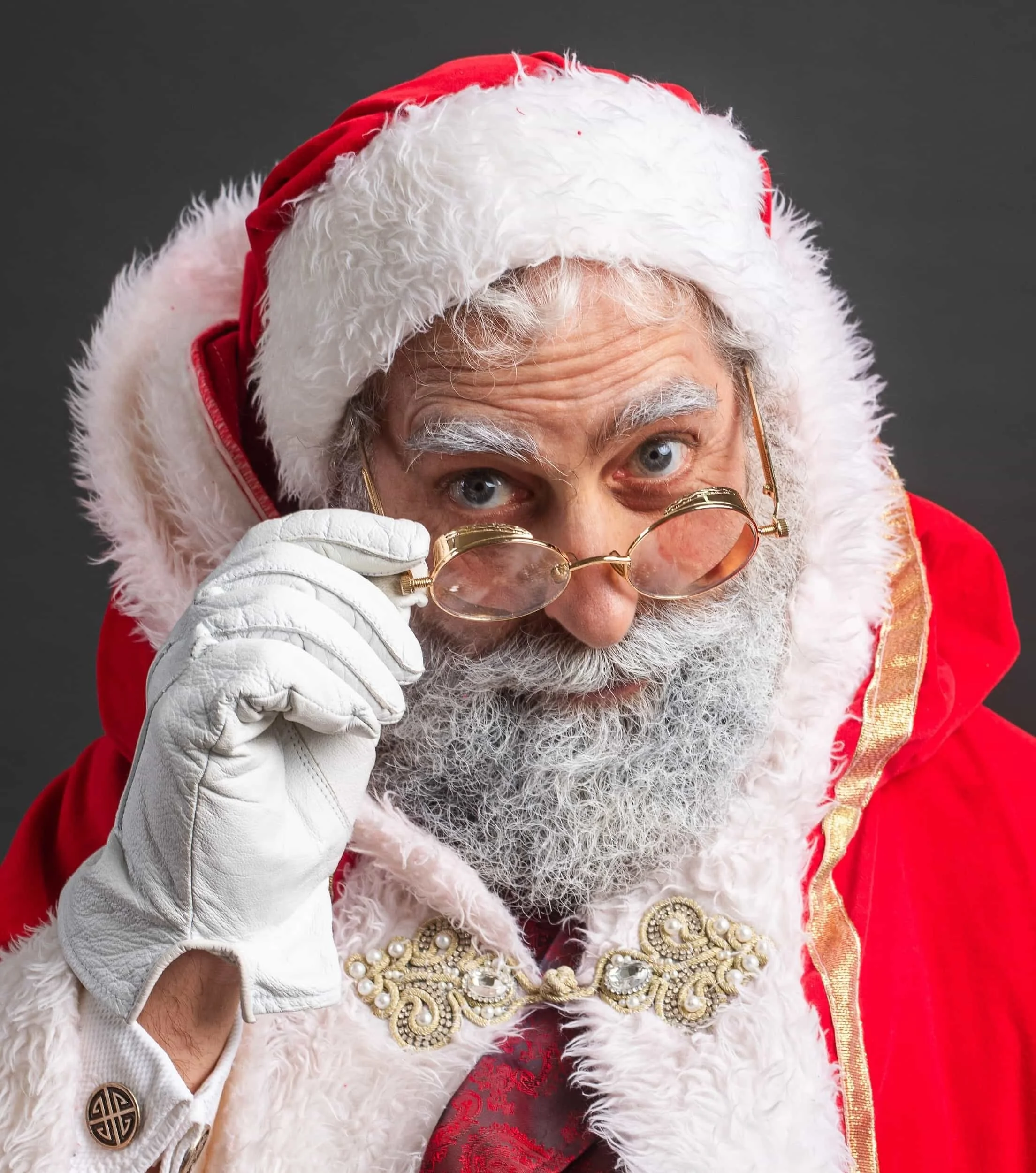 Santa Claus looking over his glasses