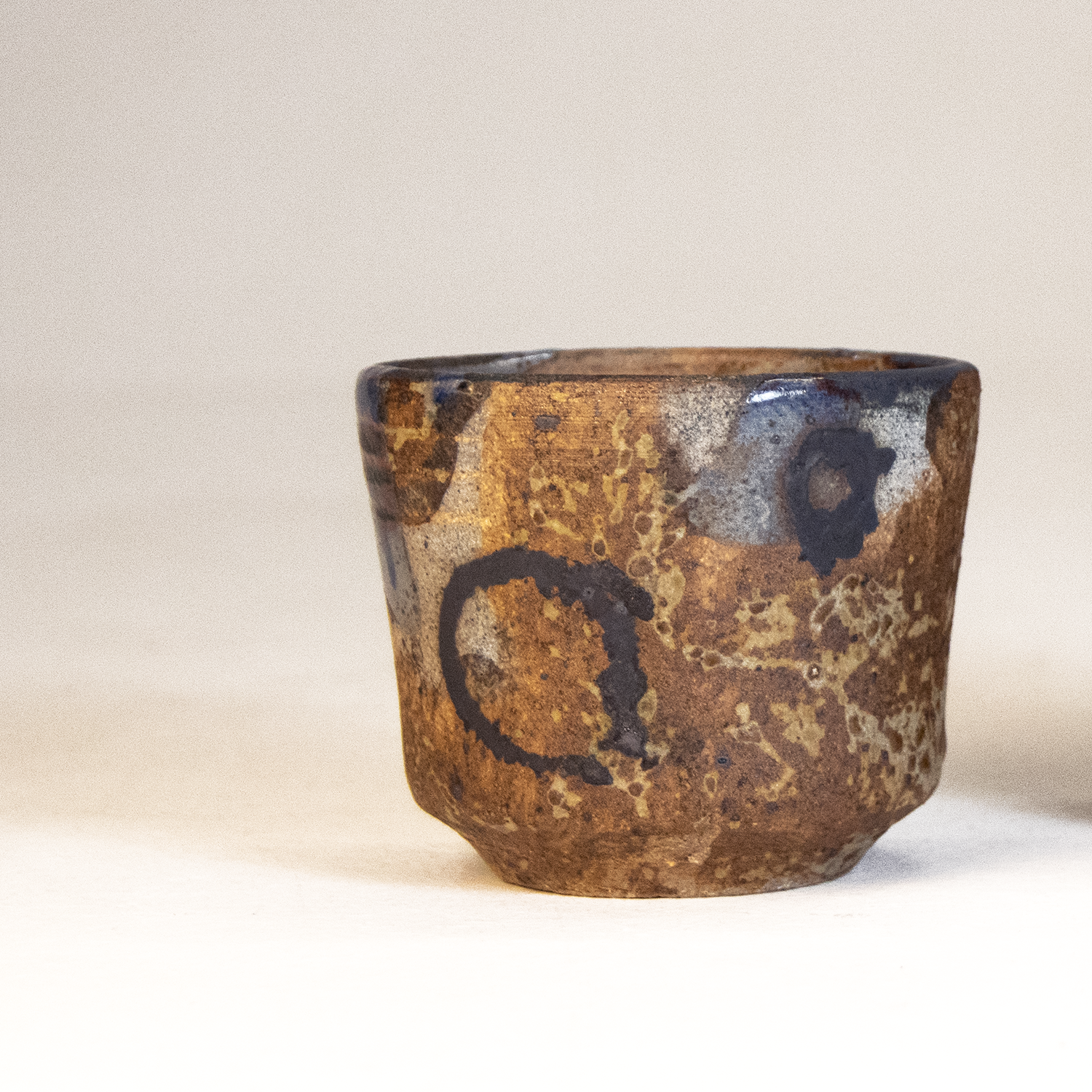 Doralice, 2026 / Stoneware, Slip, Copper Oxide, Karatsu Clear Glaze, Woodash, Reduction Fired / 3 ½ inch X 3 inch 

