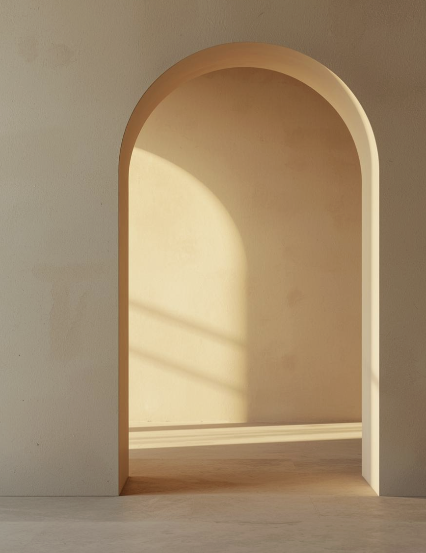 Empty arched niche in a wall with sunlight casting shadows inside.