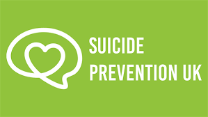 Green poster with a speech bubble containing a heart symbol, and the text 'Suicide Prevention UK'.
