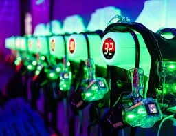 Row of arcade game machines with colorful neon lighting.