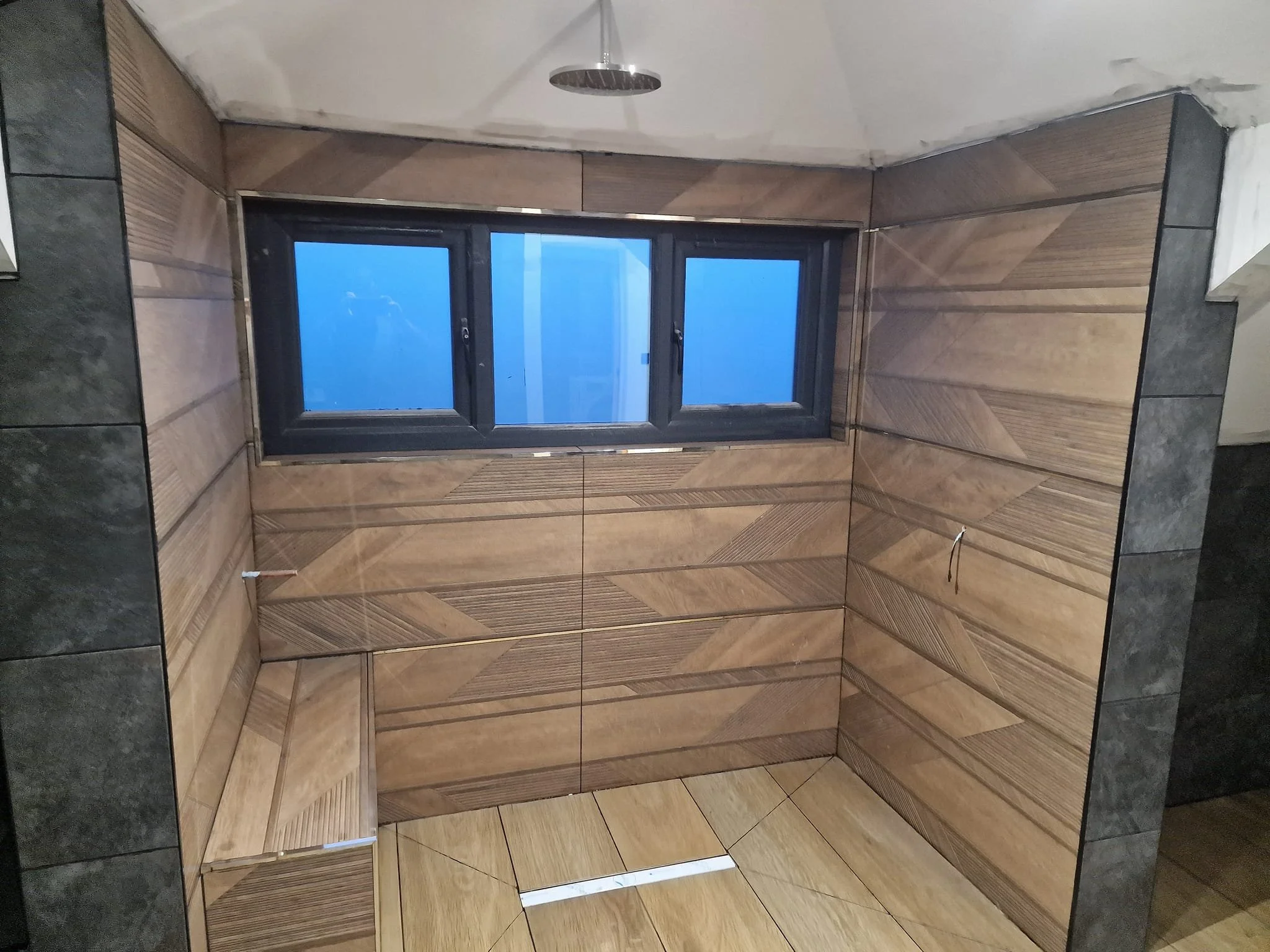 Quirky statement bathroom tiles featuring bold patterns and unique designs, expertly installed to create a standout feature in a southampton home.