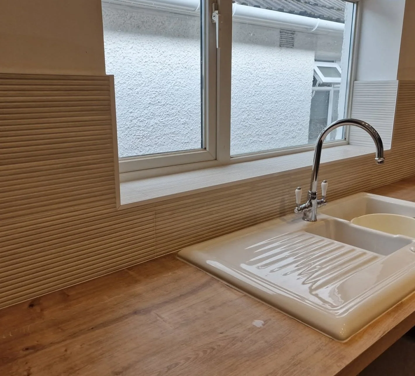 kitchen tile services southampton, upgrade your kitchen countertop with wood surface, white ceramic sink, and chrome faucet  and bamboo  effect tiles local tiler near me tile infinity  southampton