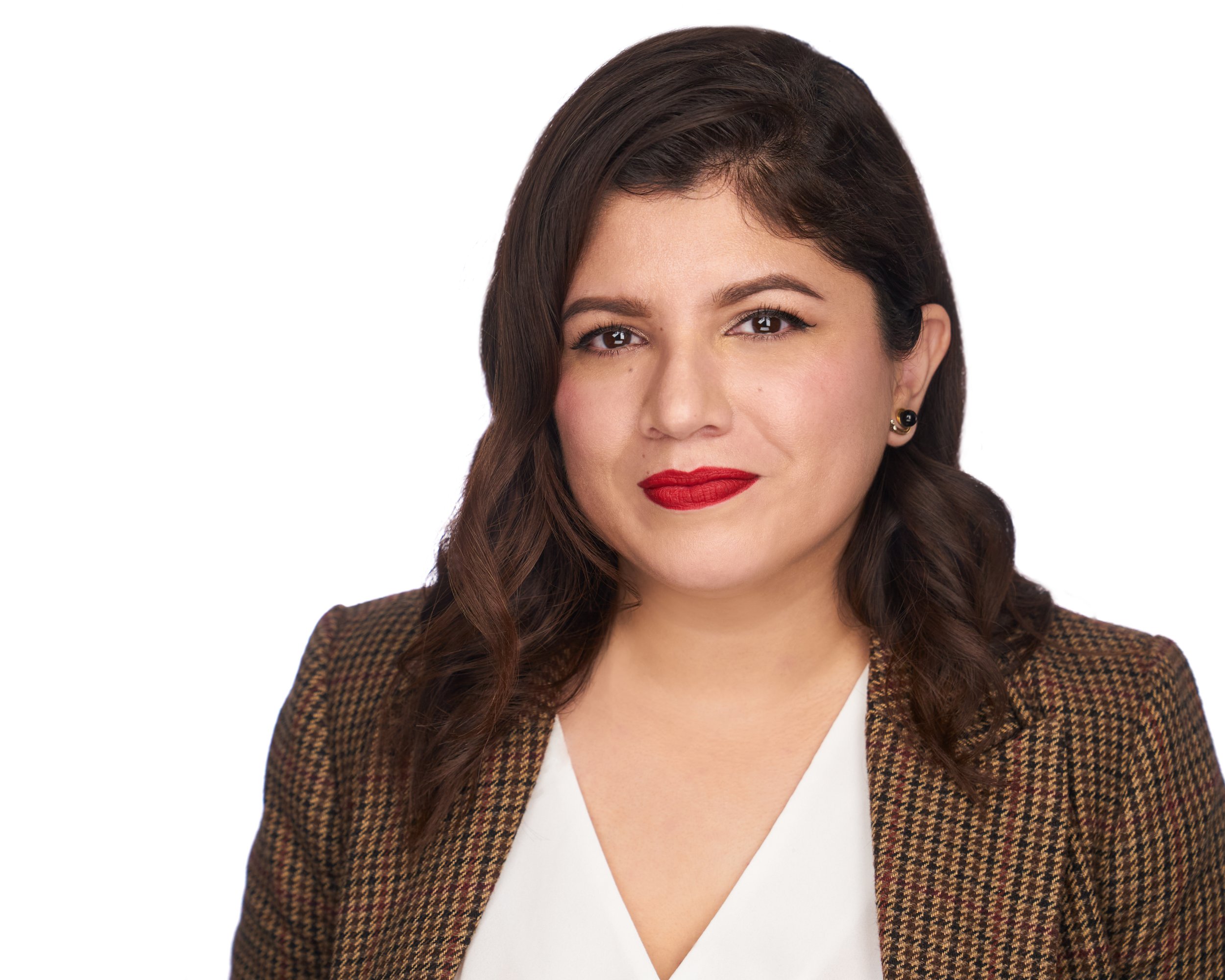A professional woman with brown hair, red lipstick, and earrings, wearing a brown checkered blazer over a white top, against a plain white background.