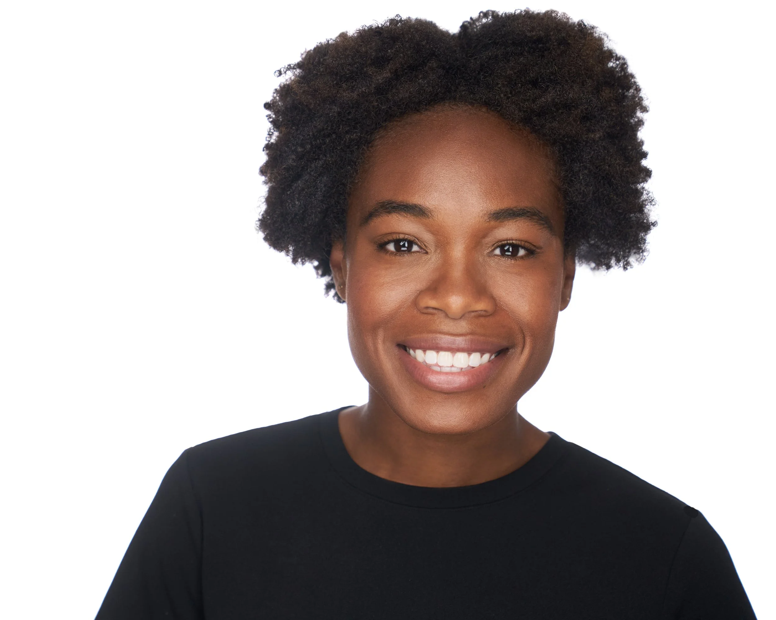 A young African American woman with natural curly hair, smiling and wearing a black shirt, against a white background.