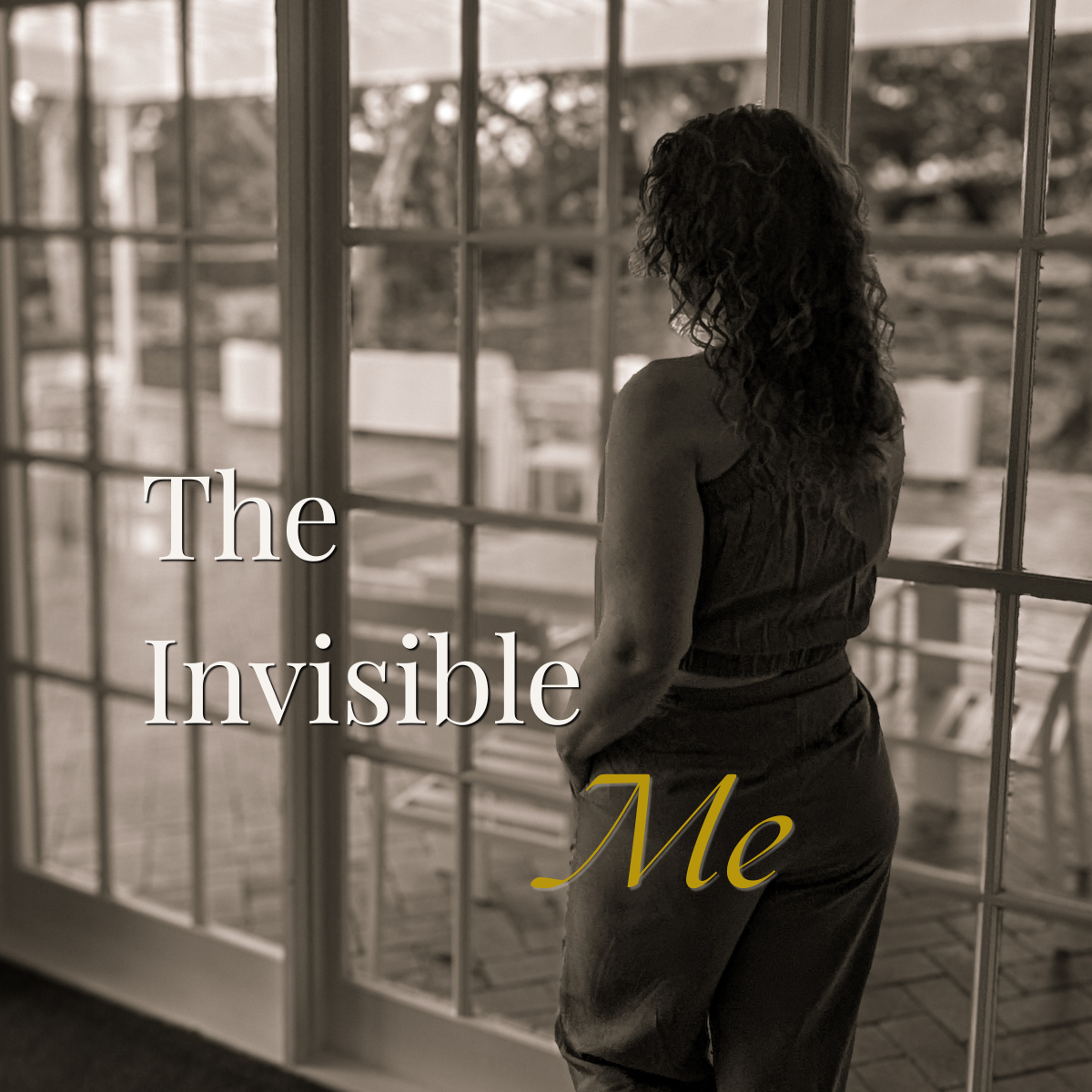 Sepia photo of a woman seen from behind, looking out through glass doors. Text overlay: "The Invisible Me".