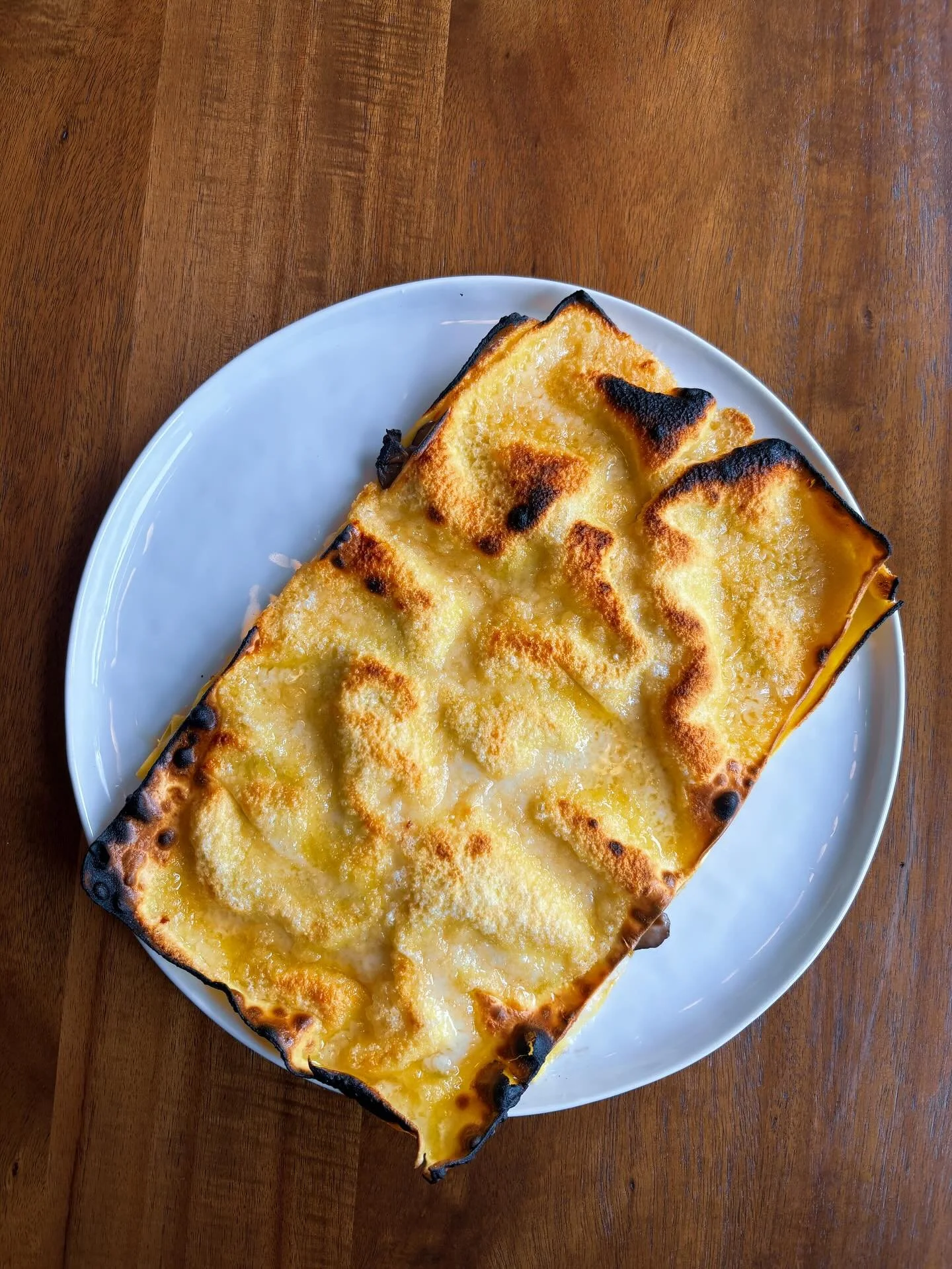 Lasagna al forno available today. This is a two-sheet lasagna made with fresh pasta from @dpnbpastashop, compt&eacute;, and filled with shiitake, oyster and cremini mushrooms and b&eacute;chamel. We&rsquo;re pretty sure Garfield would hate Mondays ju