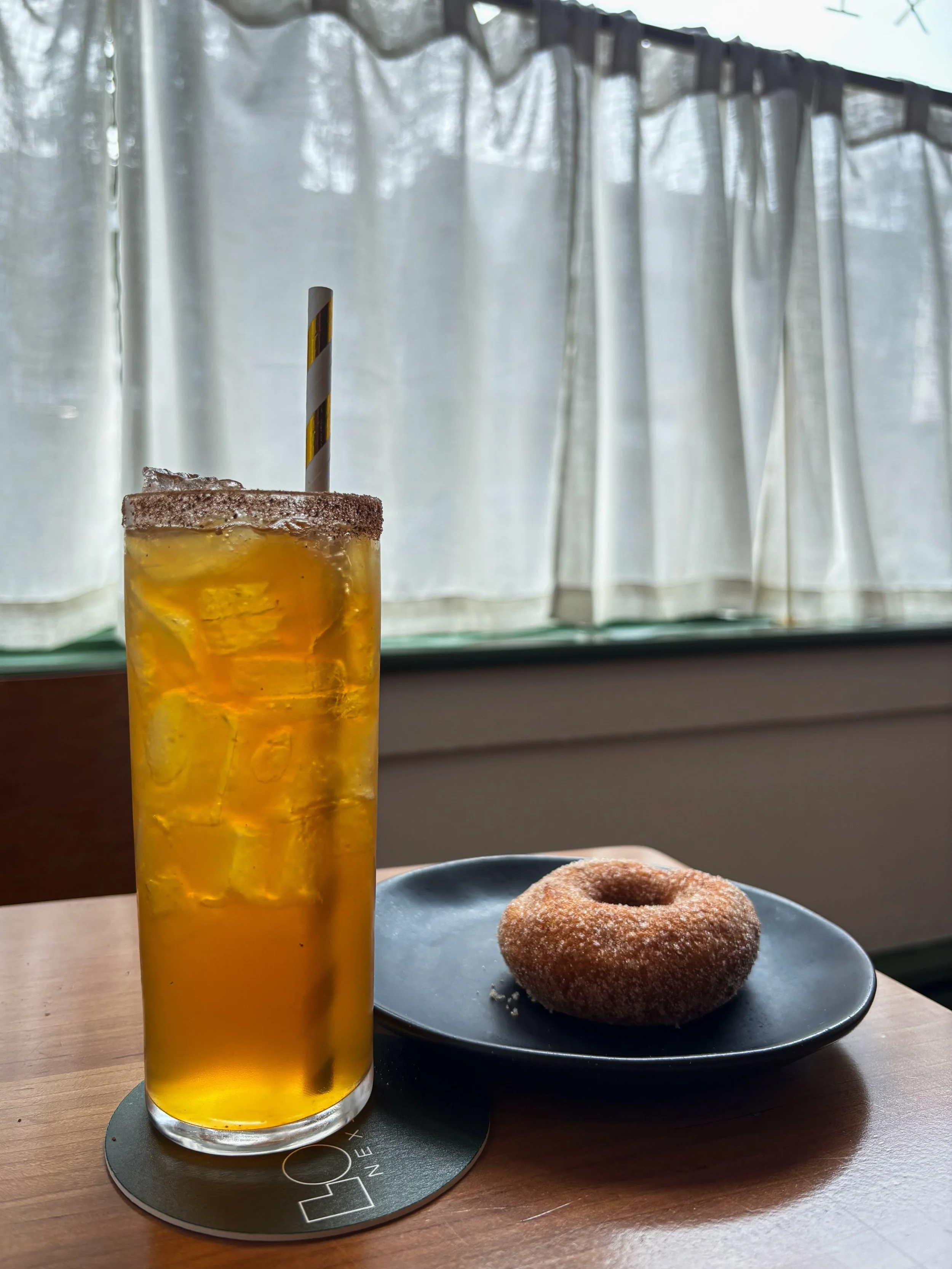 Seasonal cocktail special at Louie's this month: Boozy Apple Cider with @salingersorchard Apple Cider, Cocchi Americano and a baharat rim. (Does not include apple cider doughnut which was fresh out of the fryer when we were in Salinger's picking up t