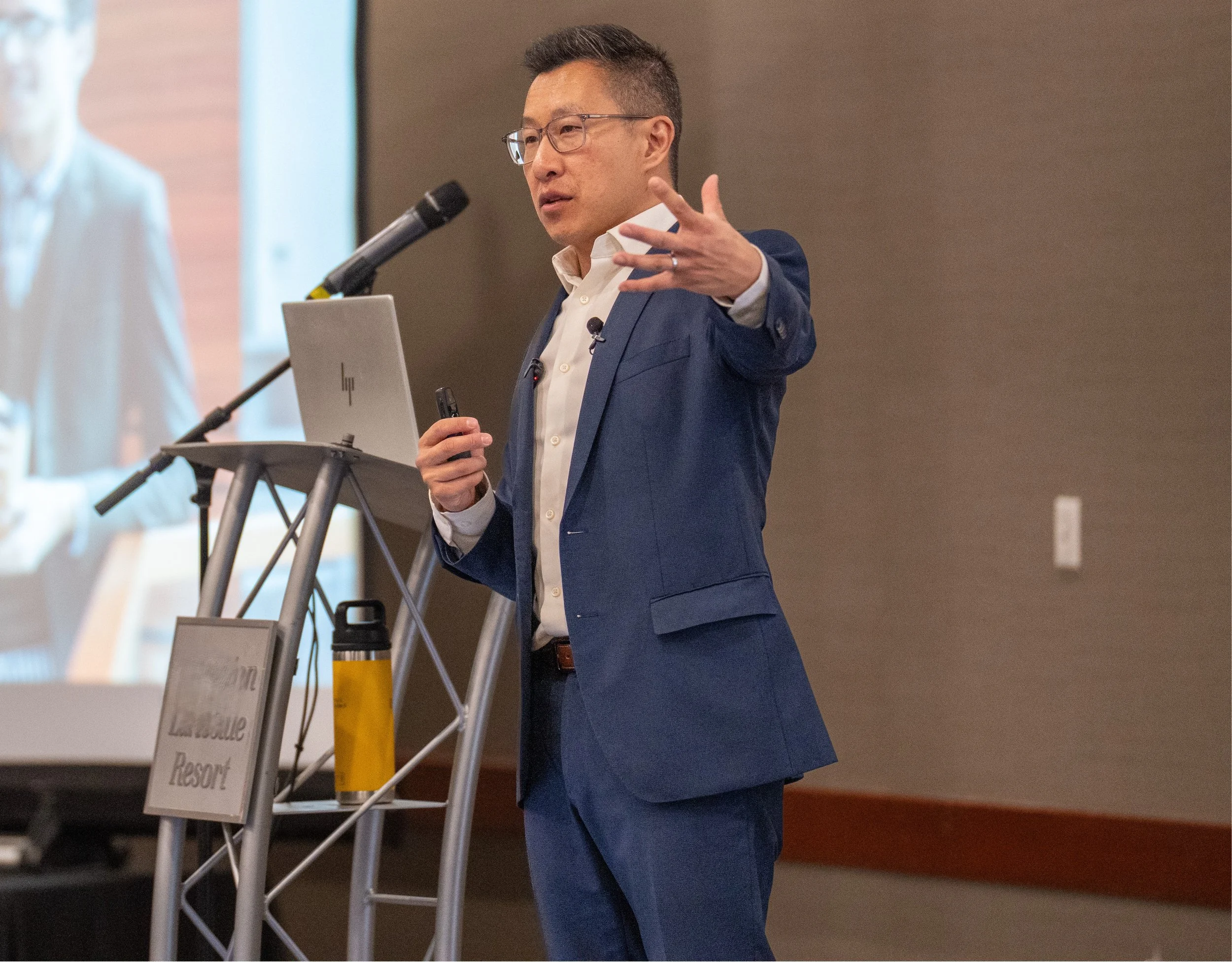 As Asian Man speaking on stage during keynote