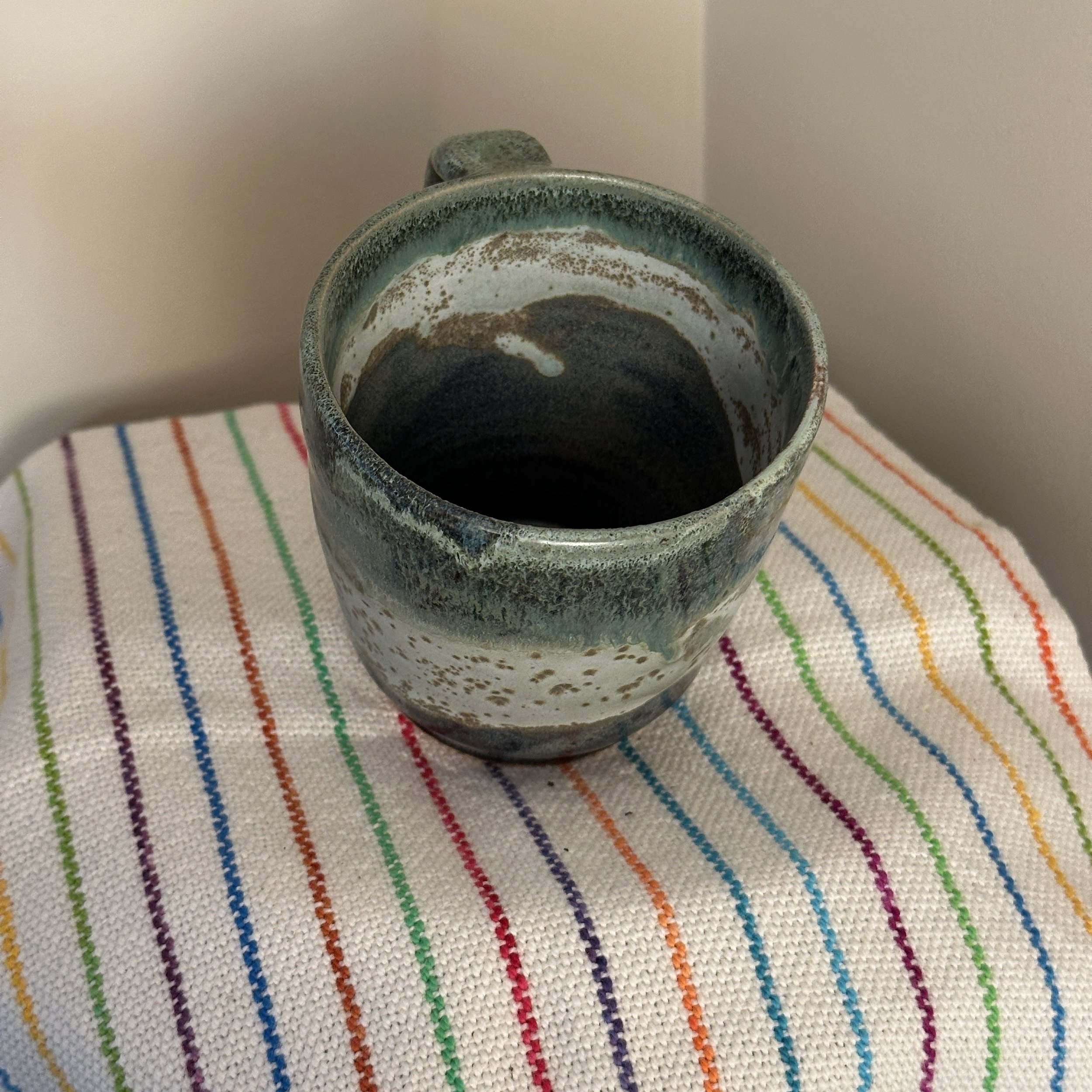 Large trip-color mug interior, the stripes also happen to be where I should pour my coffee to and then top up with milk.
