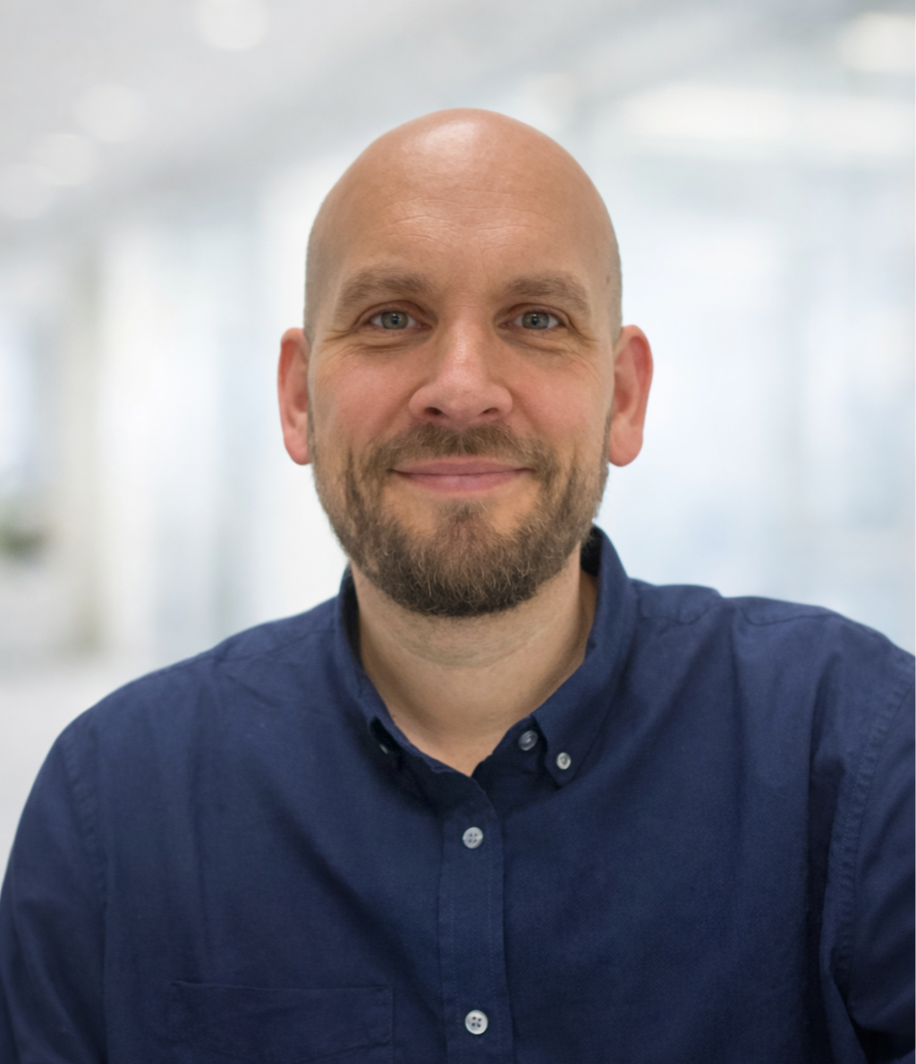 Picture of Jonathan Baker. A bald man with a beard.