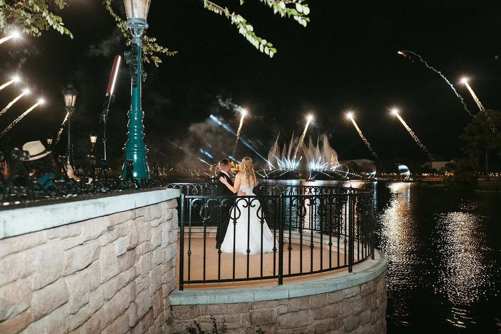 ✨ A love story straight out of a fairy tale ✨

Under the glow of a street lamp, with the water shimmering below and fireworks lighting up the sky, these two said forever. Proof that magic isn&rsquo;t just imagined&mdash;it&rsquo;s beautifully planned