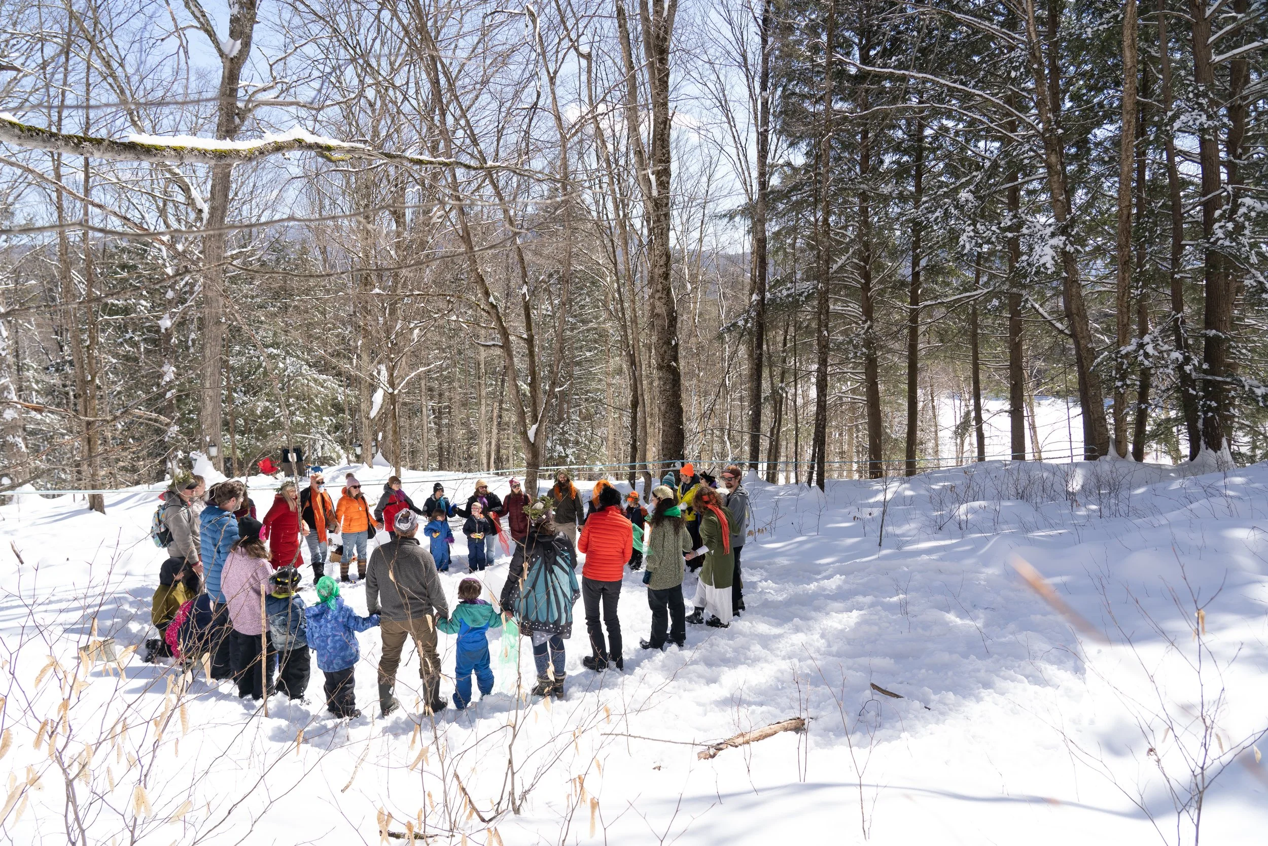 Group circle in snow - revitalizing culture.jpg