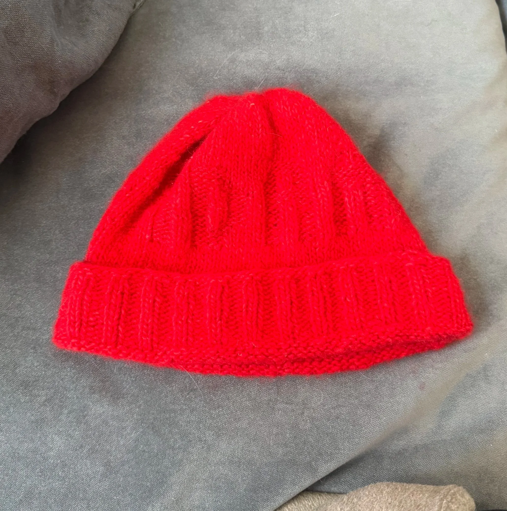 the hat is literally so bright red it looks neon