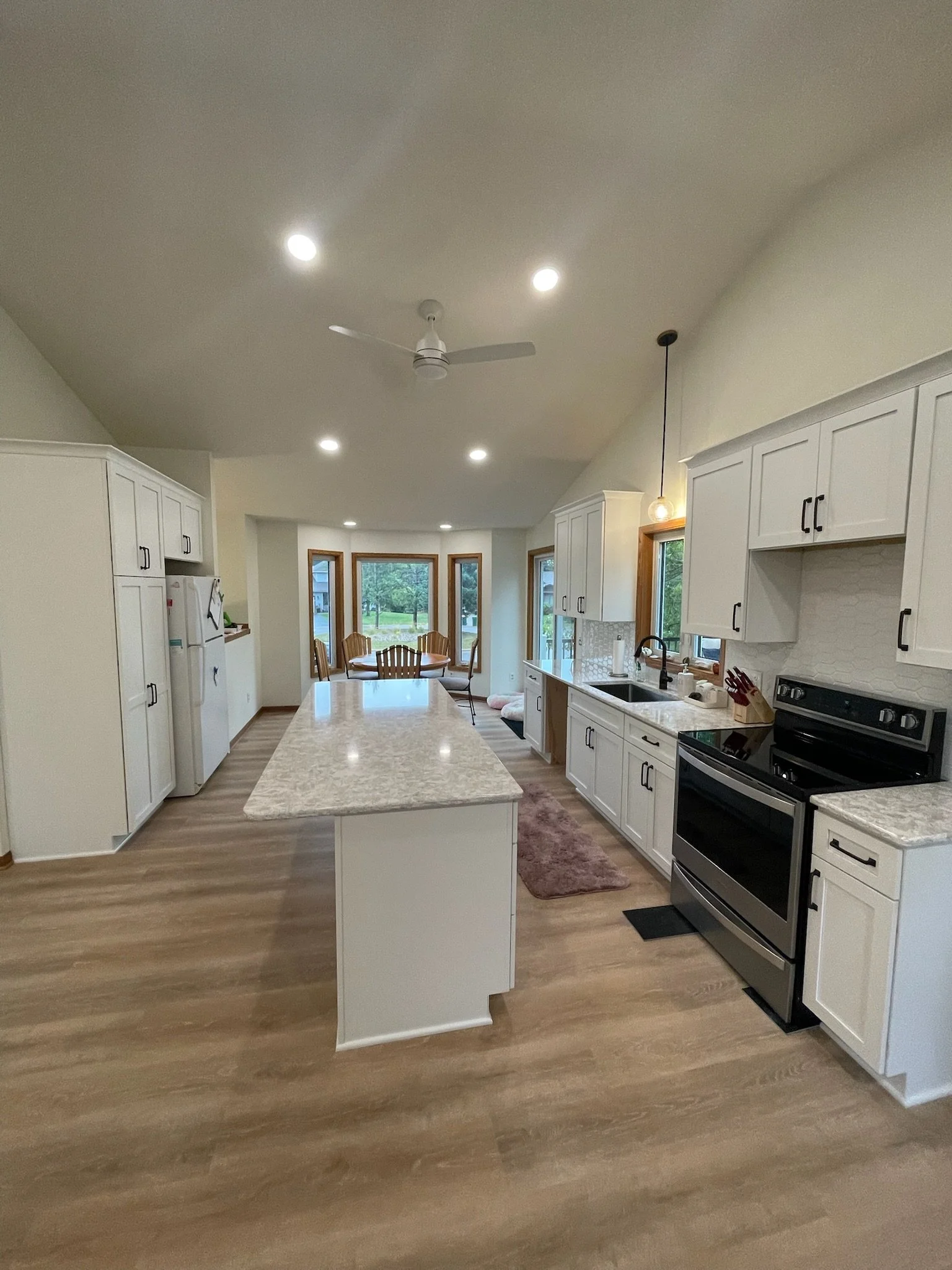 2025 Minnesota kitchen remodel with white shaker cabinets and quartz island countertop