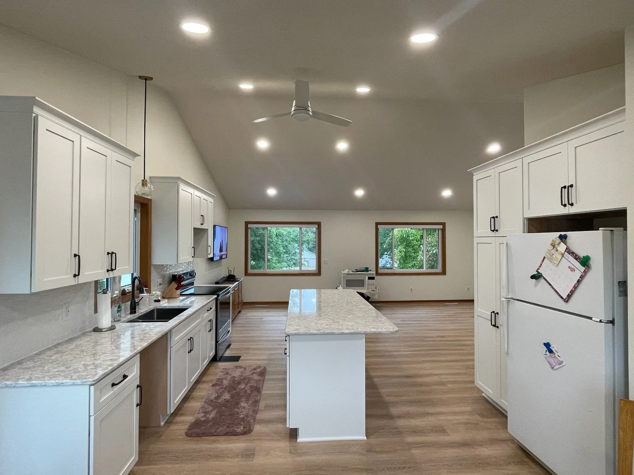 Modern white shaker kitchen cabinets with soft-close drawers in Minnesota remodel