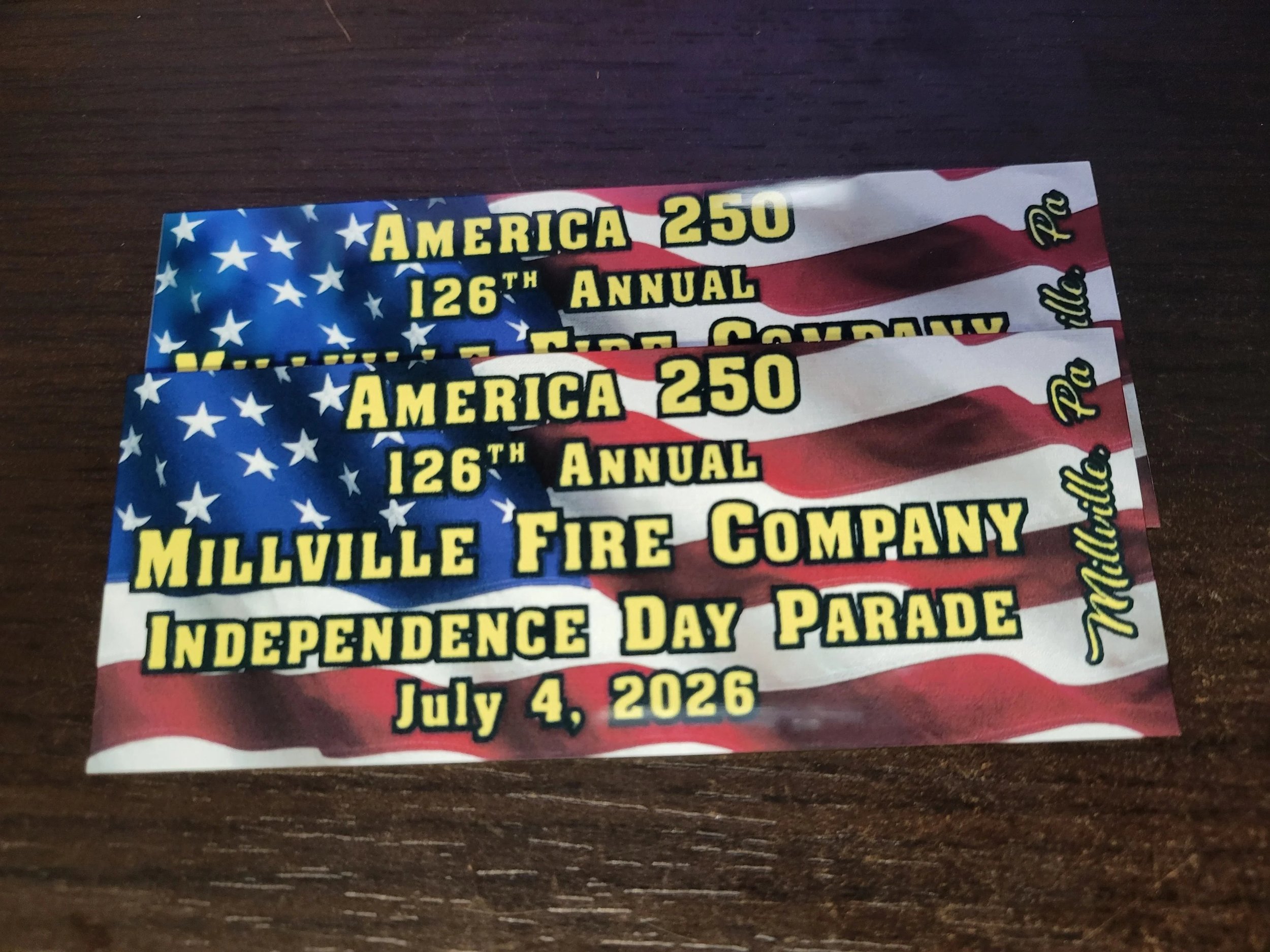 American flag-themed dashboard plaque for the 126th annual Millville Fire Company Independence Day Parade on July 4, 2026.