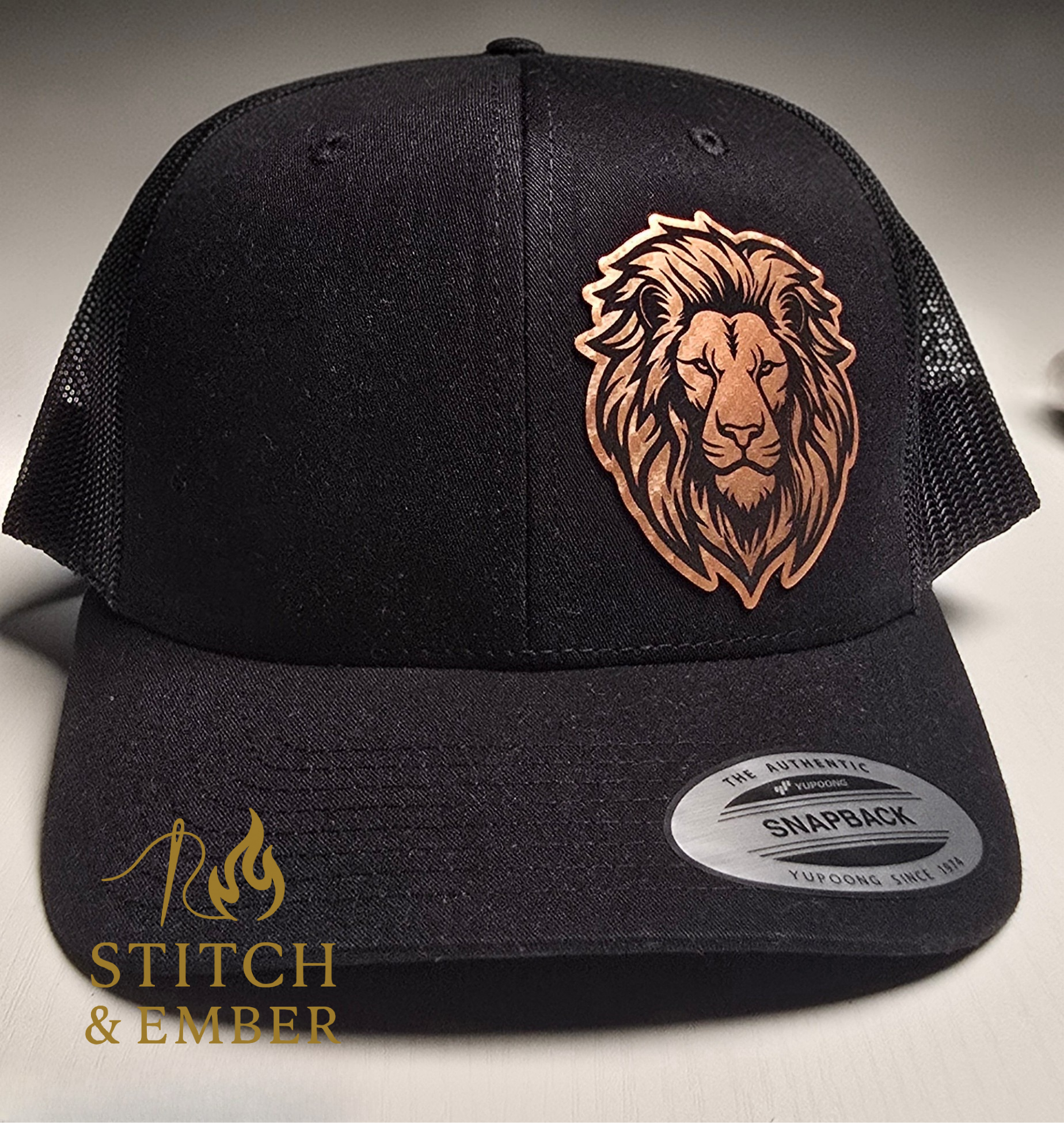 Custom Lion Patch Trucker Hat – Black Mesh Snapback with Copper Carbon Fiber Leather Engraving
