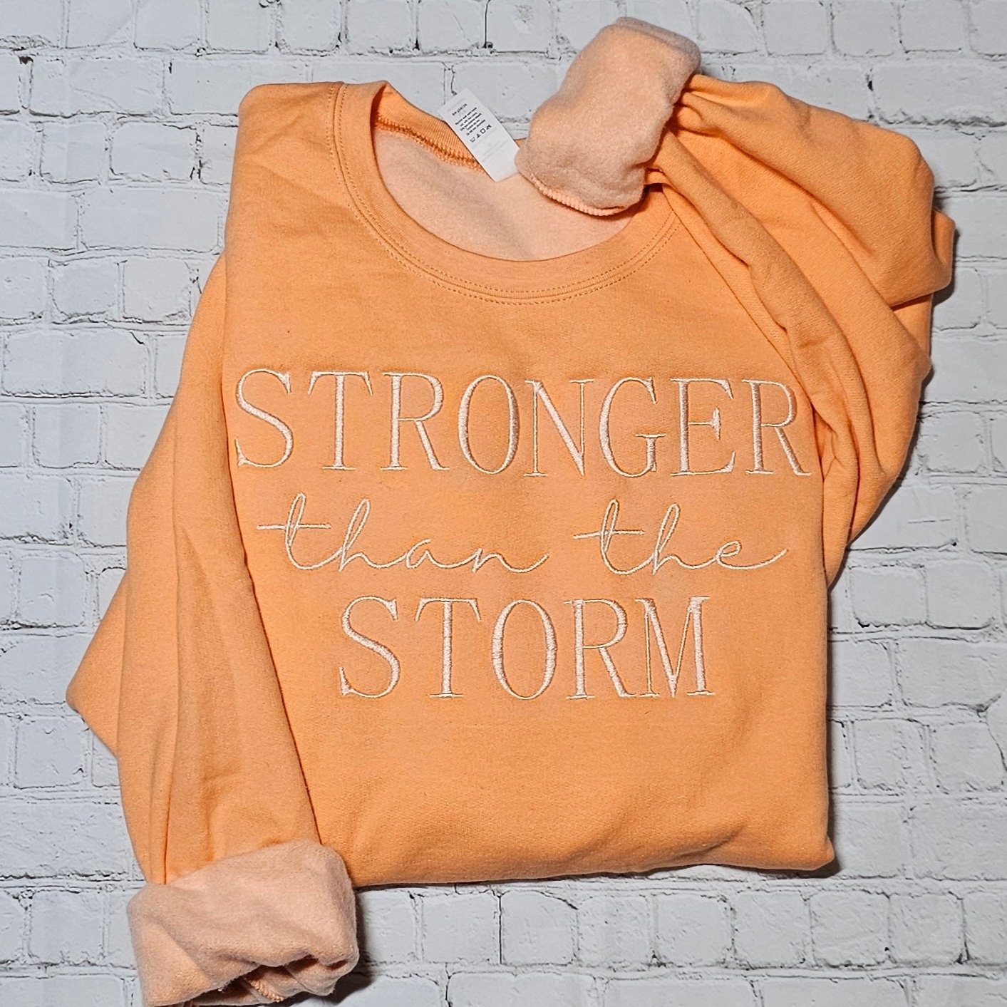 Stronger Than the Storm Unisex Embroidered Sweatshirt