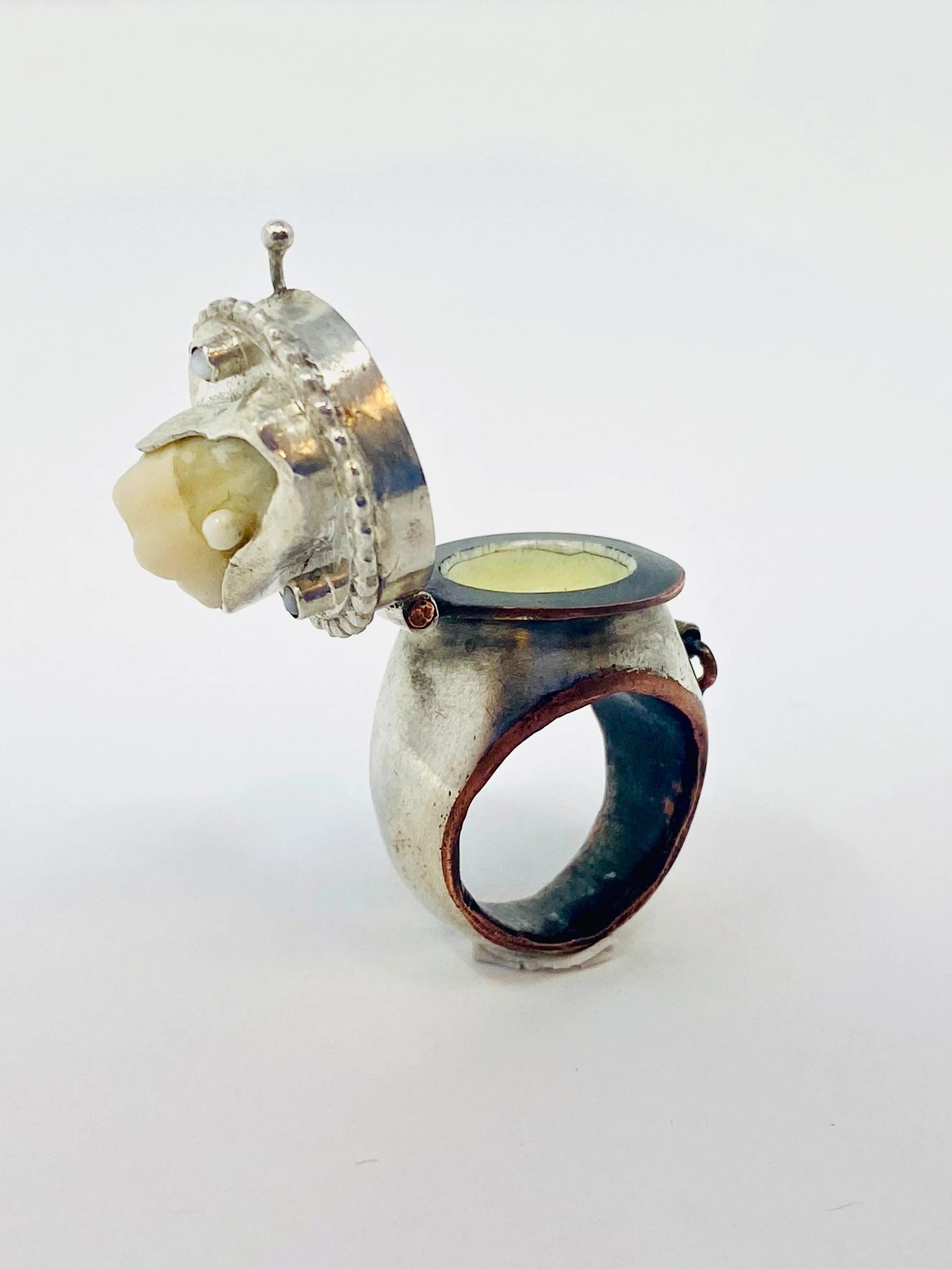 A Sprinkle of Wisdom | Opened cap, view of internal enameled chamber