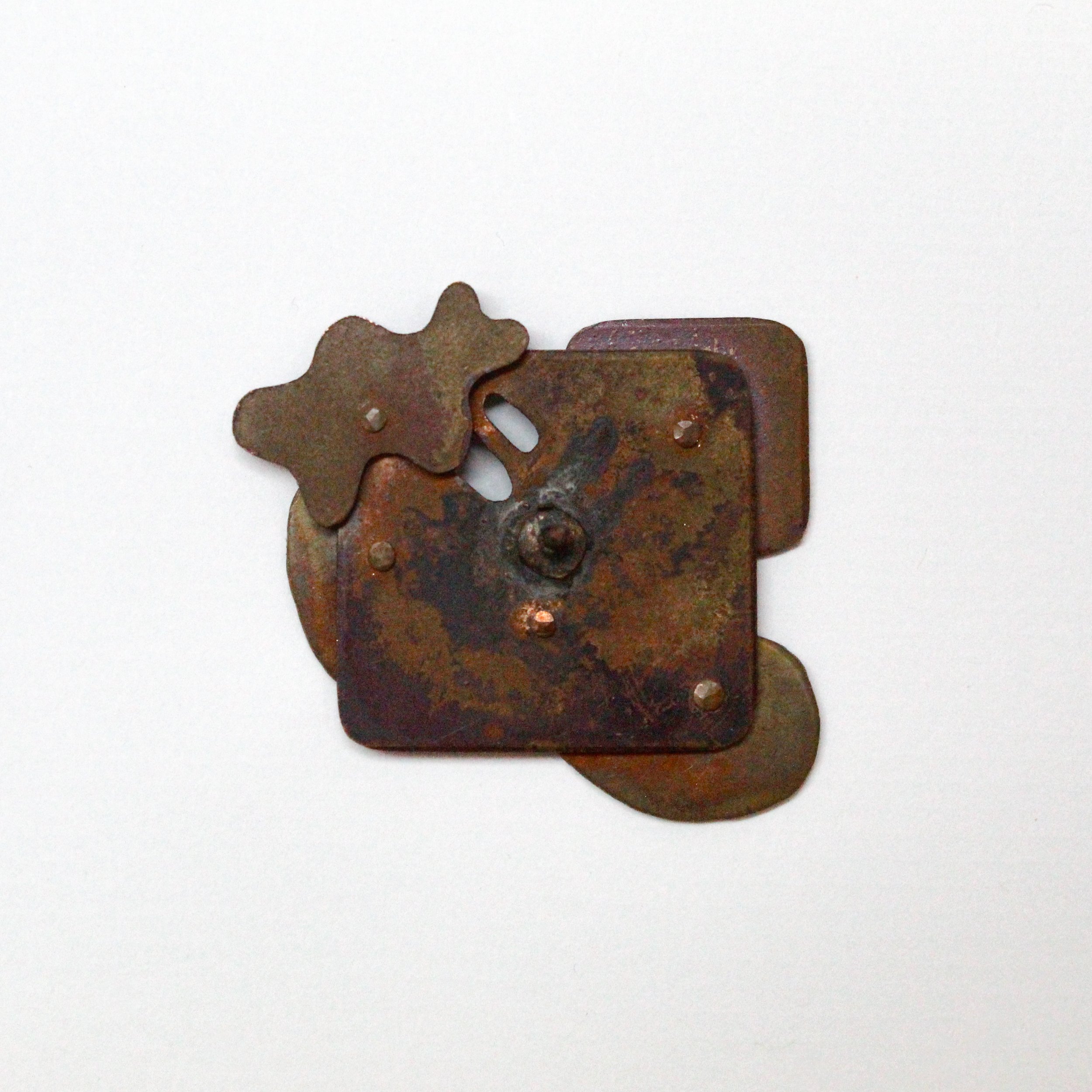 195197231244 | copper, assorted temper patination | 1.375" x 1.375" | 2024 | Back