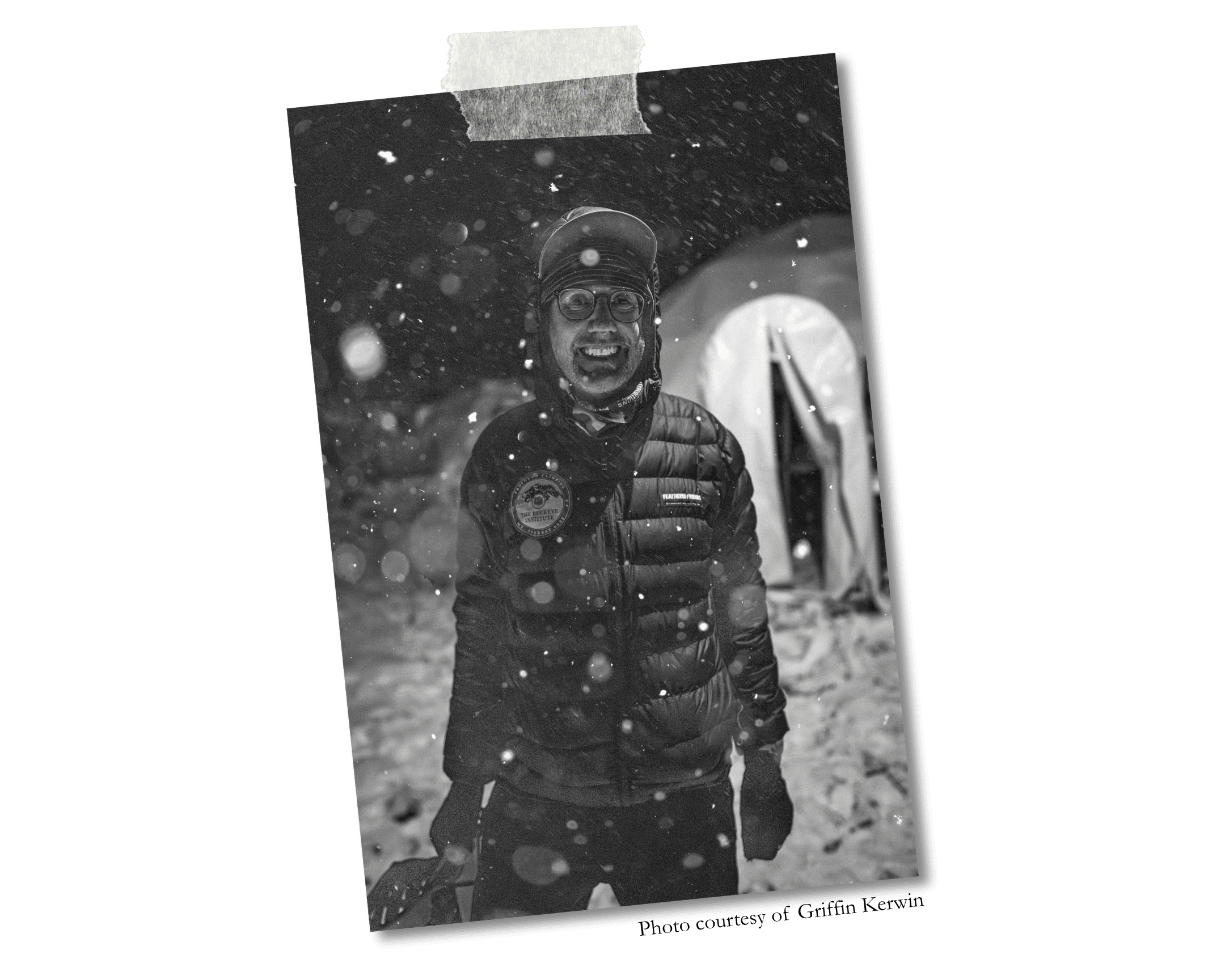 Robert Alt outside his tent at Everest Base Camp with snow falling.