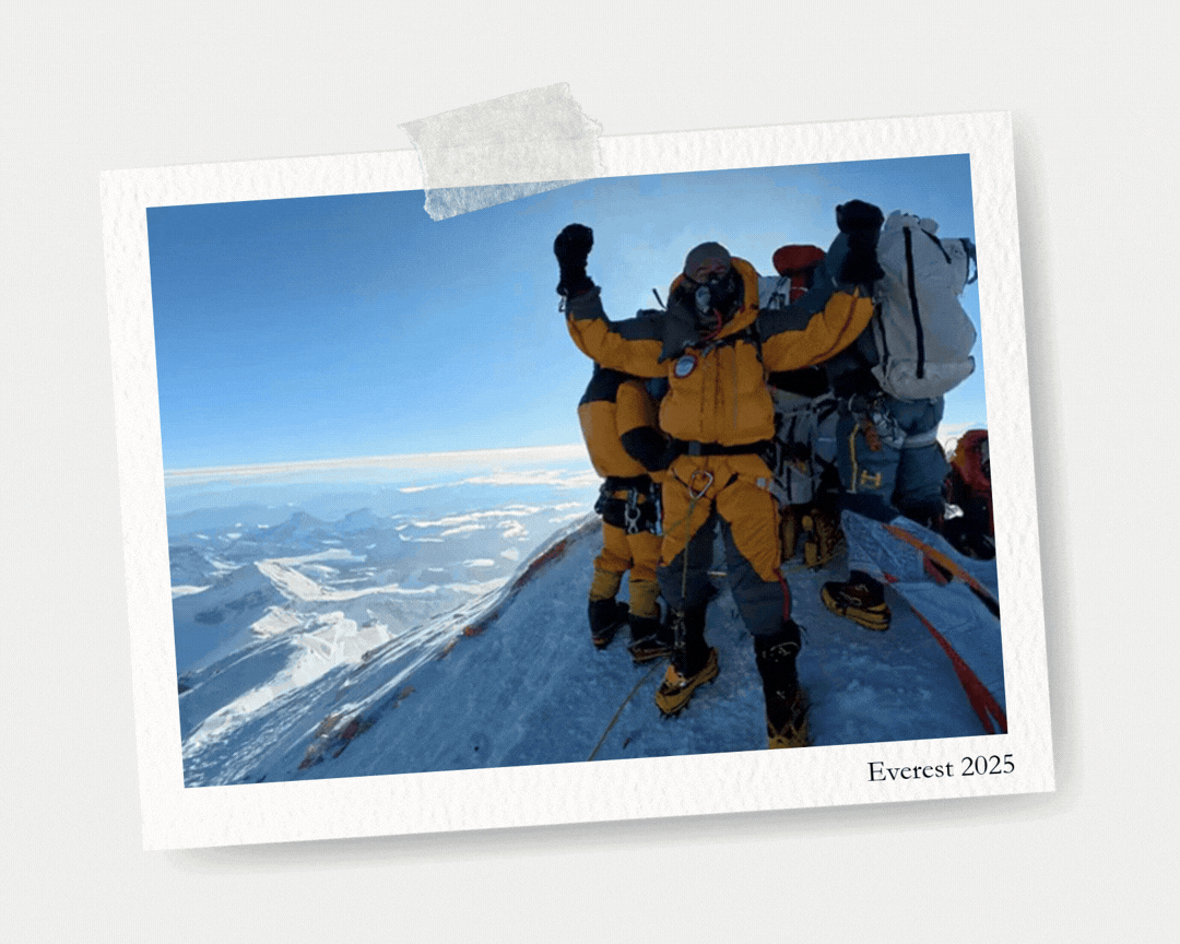Robert Alt celebrating at the summit of Everest.