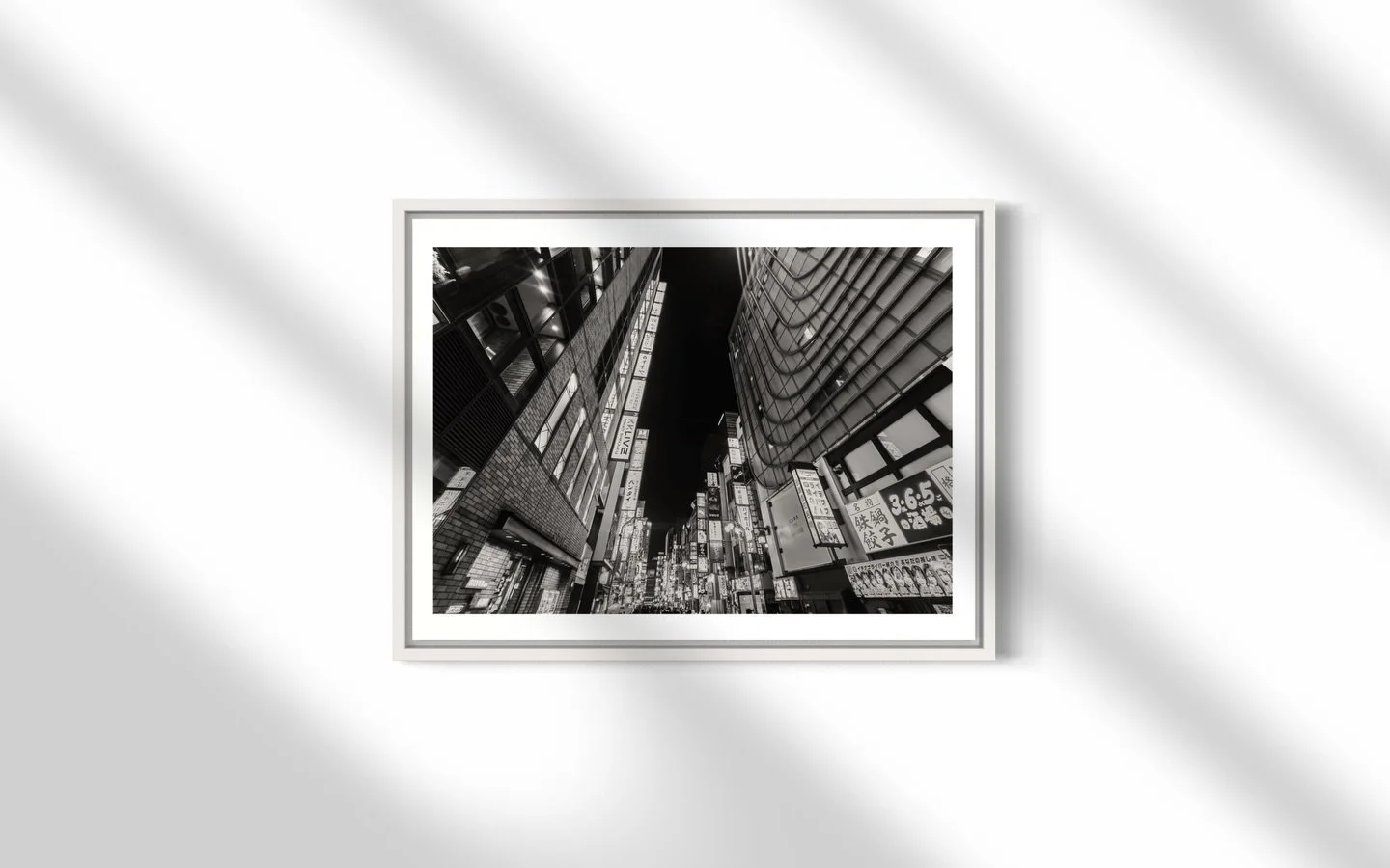 Captured in the fleeting pause of a Tokyo intersection. This piece embodies the grandeur of Tokyo; pulsing with constant motion&mdash;bright neon lights reflect off glass skyscrapers and bustling shopfronts, while massive digital billboards tower ove