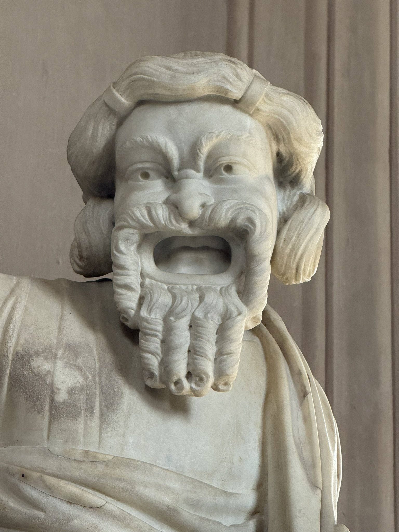  I don’t know the name of the piece, but it depicts an actor with a mask. All actors wore these masks, both to show their expressions to the audience and also to function like an amplifier (you can see around the mouth how it functions like a funnel)