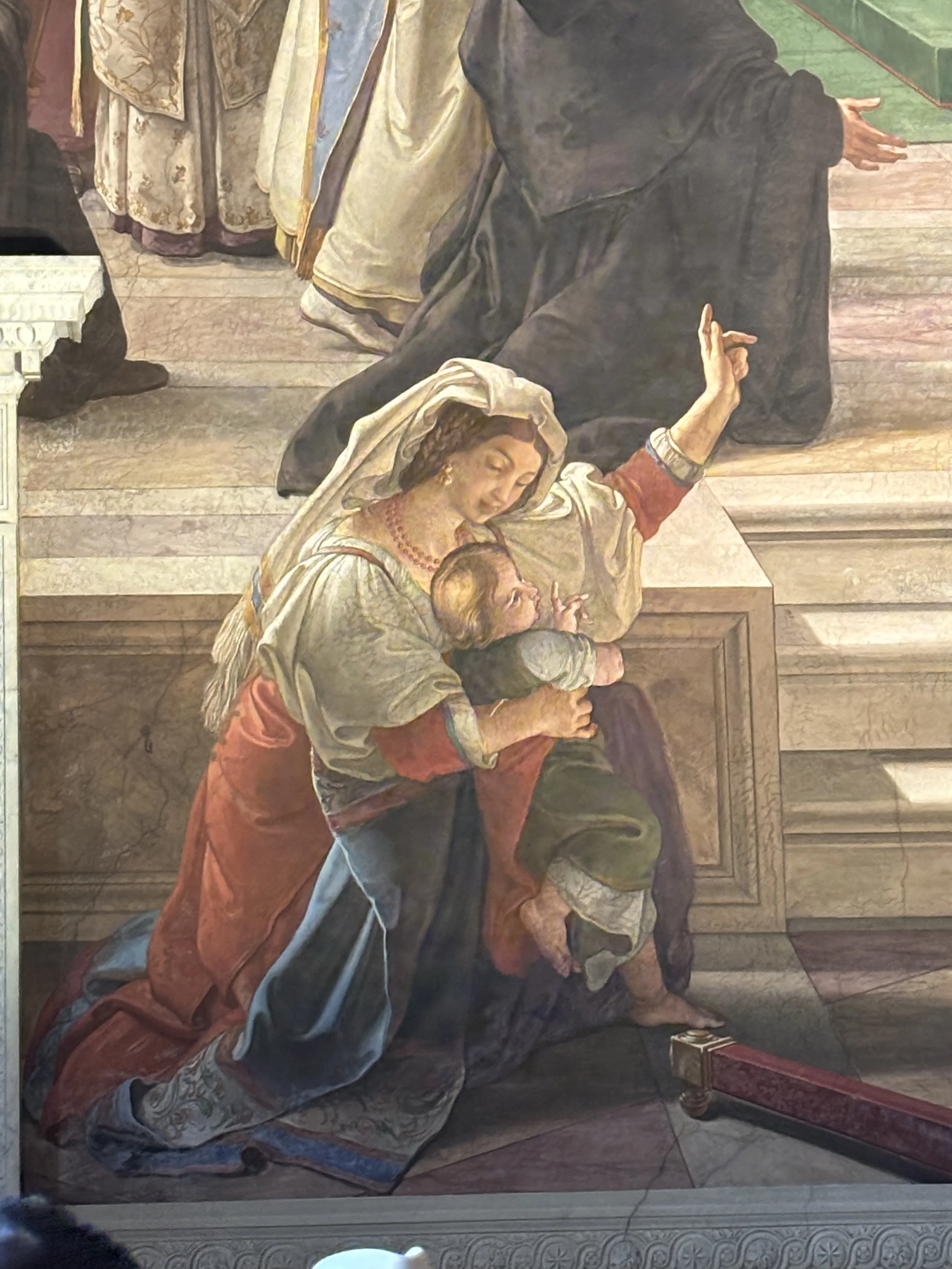  I love this picture, because so often either I or my wife will point to things, in just this way, to our children. We are also pointing towards a statue, or a painting, or the Eucharist itself. Always trying to direct their gaze towards Christ. In r