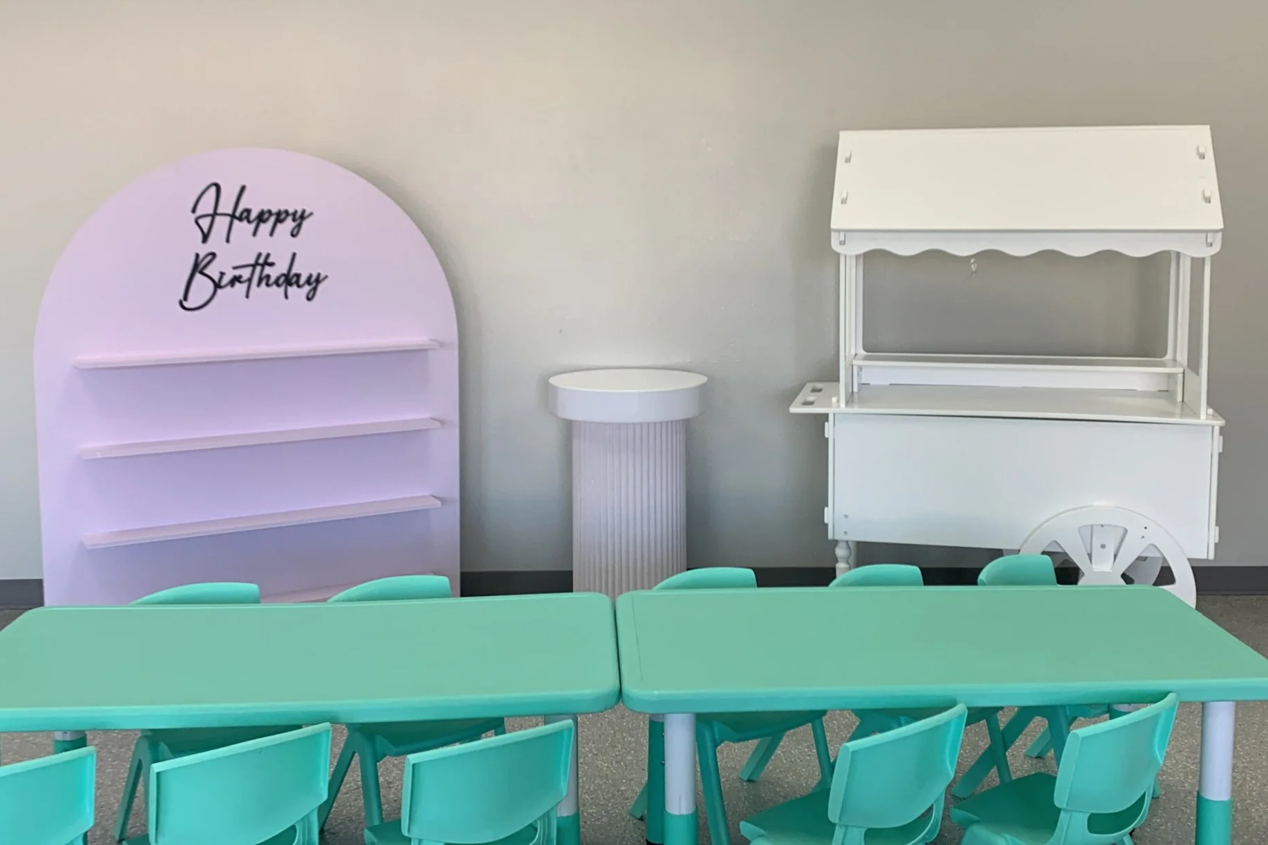 Blank slate party rental set up. Party favor stand, Cake pillar, and dessert cart. Table and Chairs included