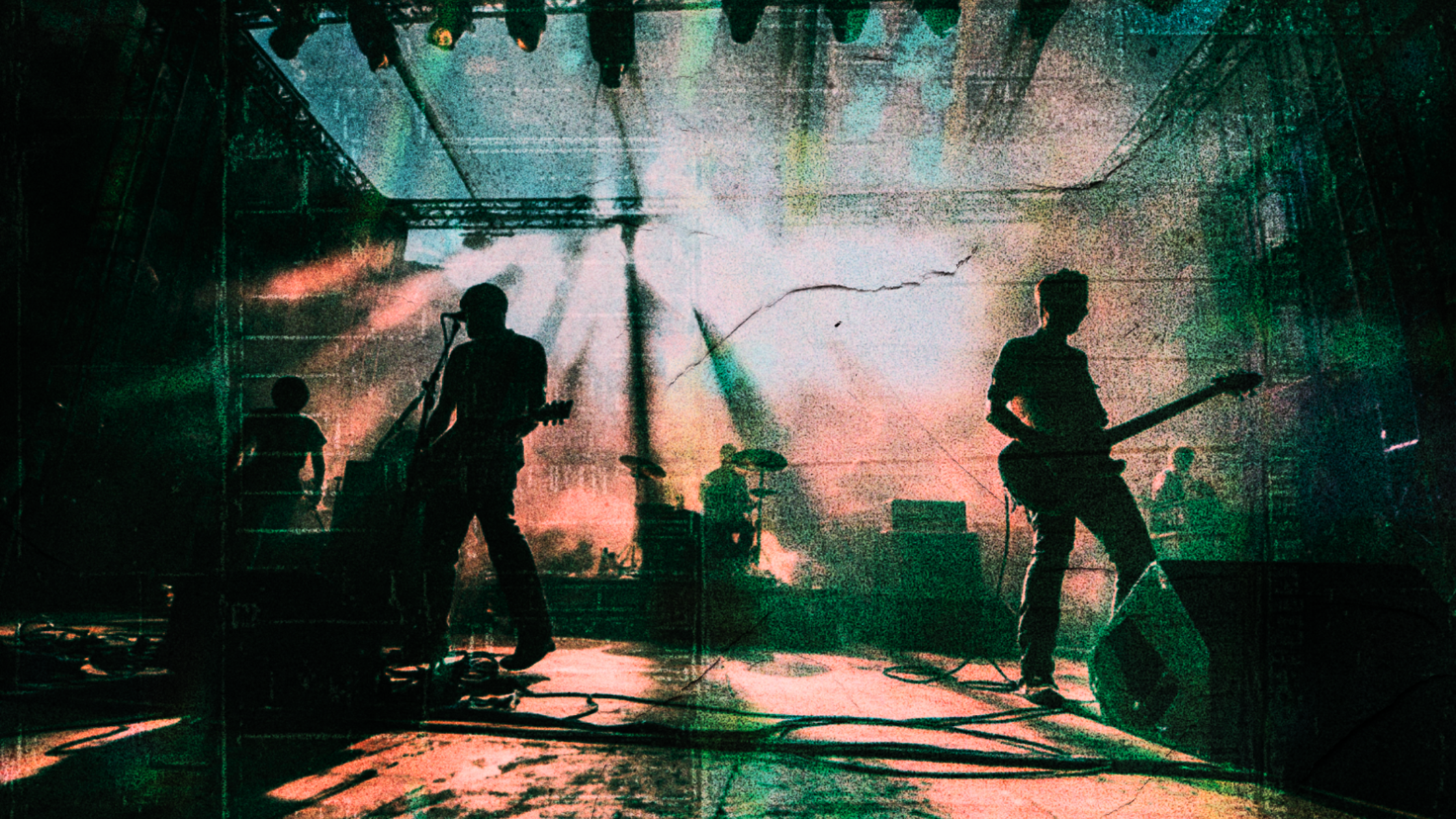 Silhouettes of a band playing on stage during a concert, with colorful stage lights and a textured overlay.