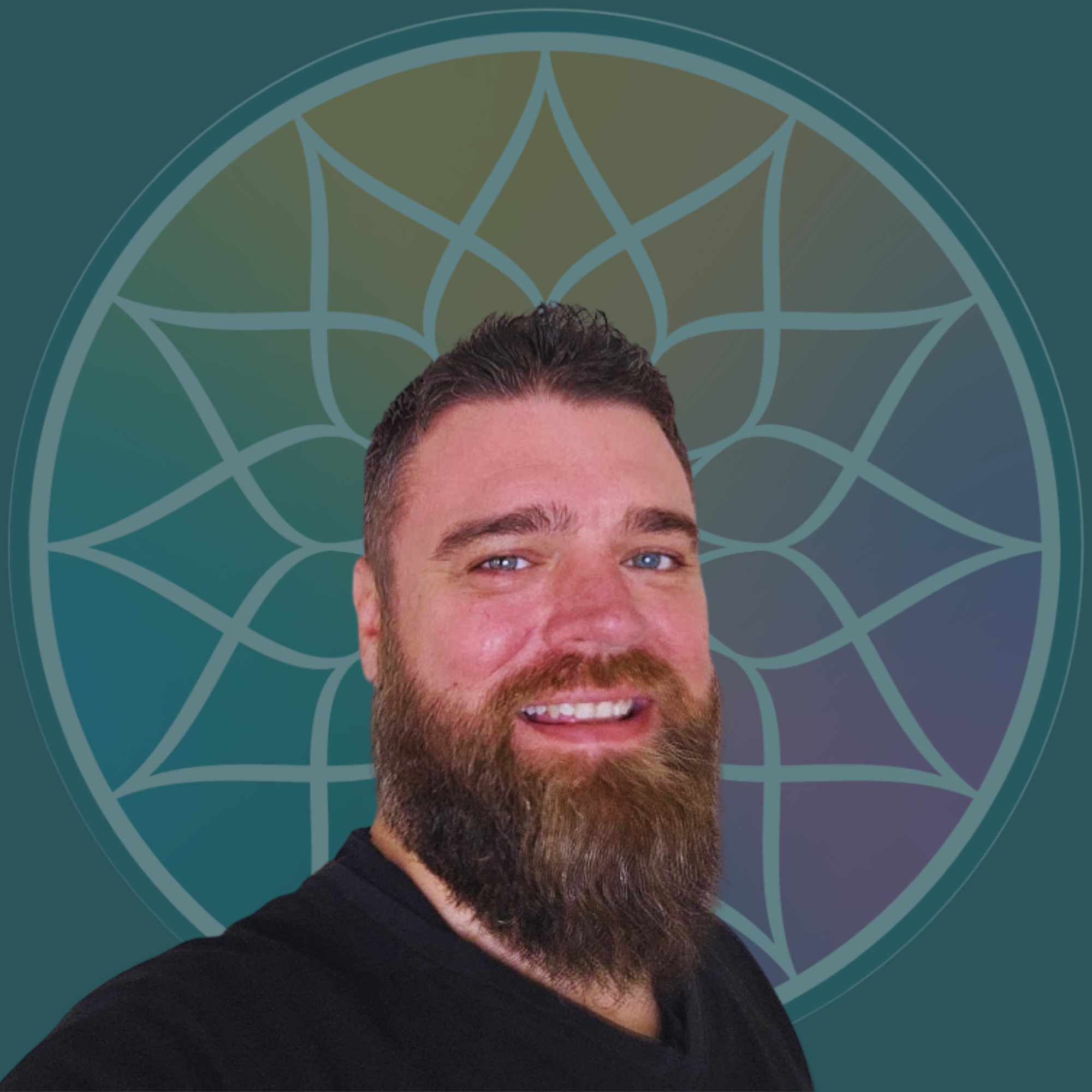 A man with a beard smiling in front of a geometric pattern background.