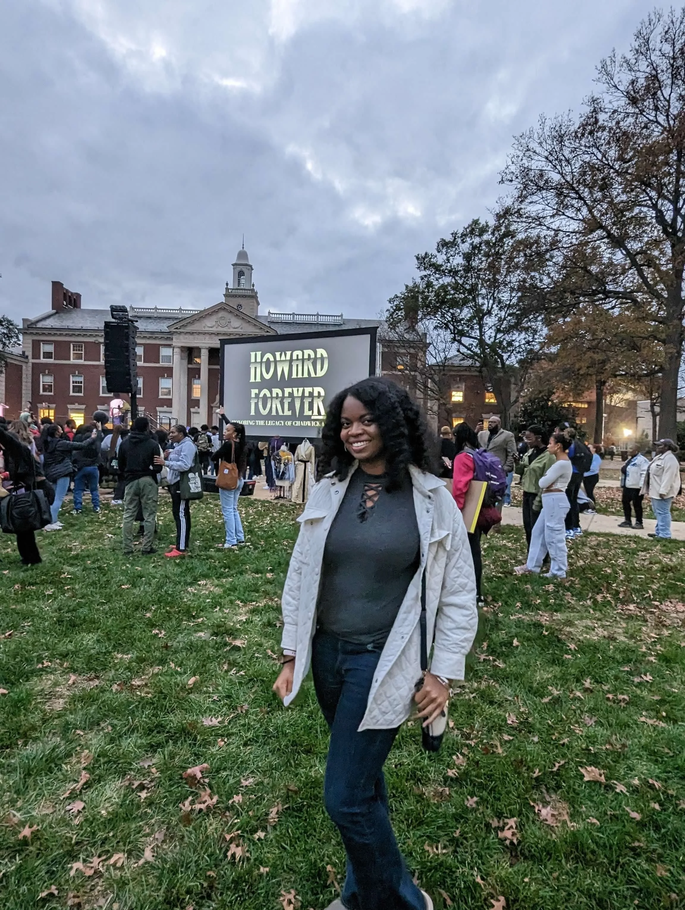 Black woman smiling on Howard University Campus at Chadwick Boseman Remembrance Day.